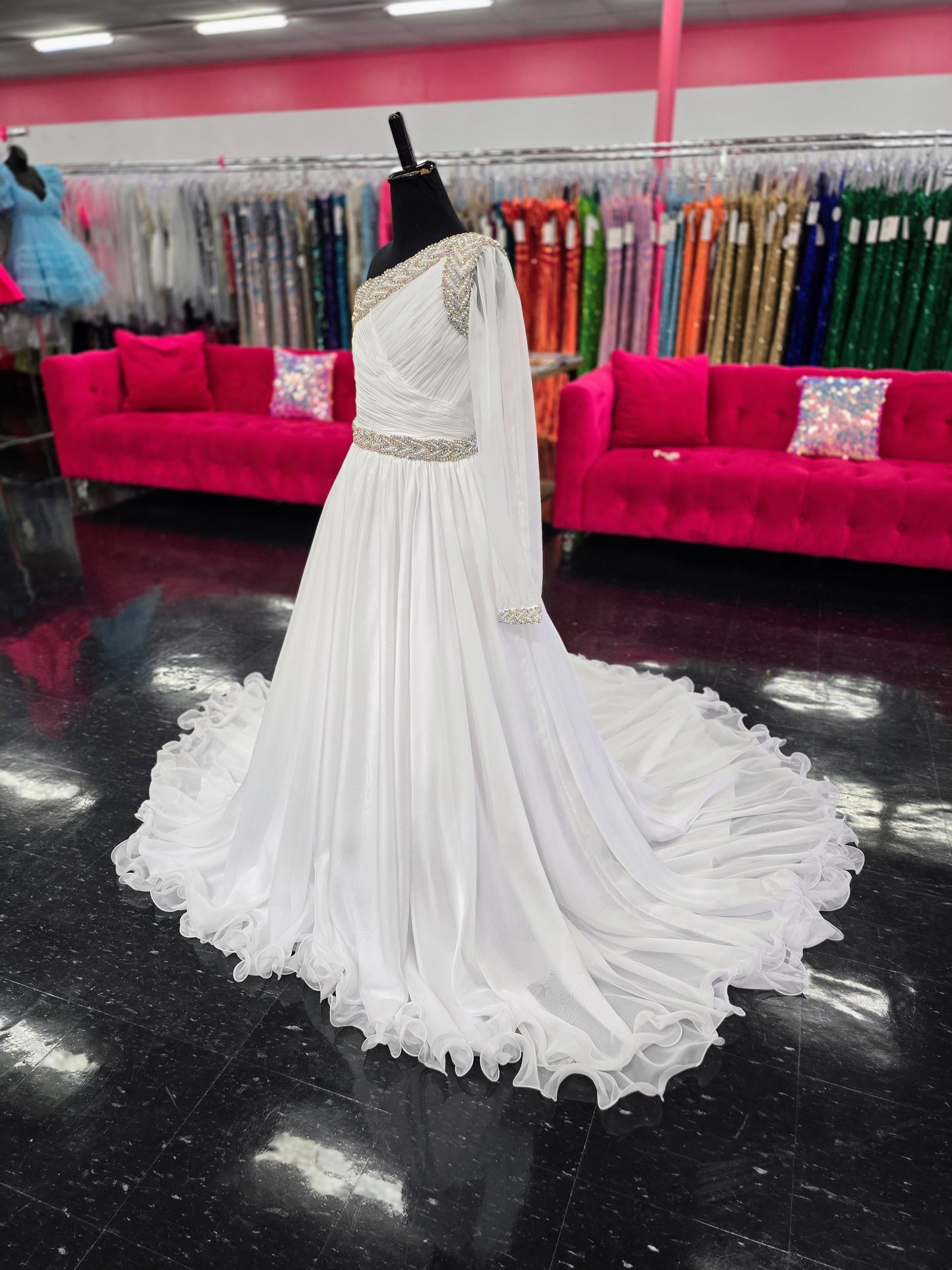 Be the epitome of grace and elegance in the Samanatha Blake 1014 one shoulder Long Sleeve Pageant Dress. Made with delicate chiffon and a stunning crystal embellished bodice, this dress features a one-shoulder design and long sleeves for a sophisticated look. Perfect for any pageant or formal event.