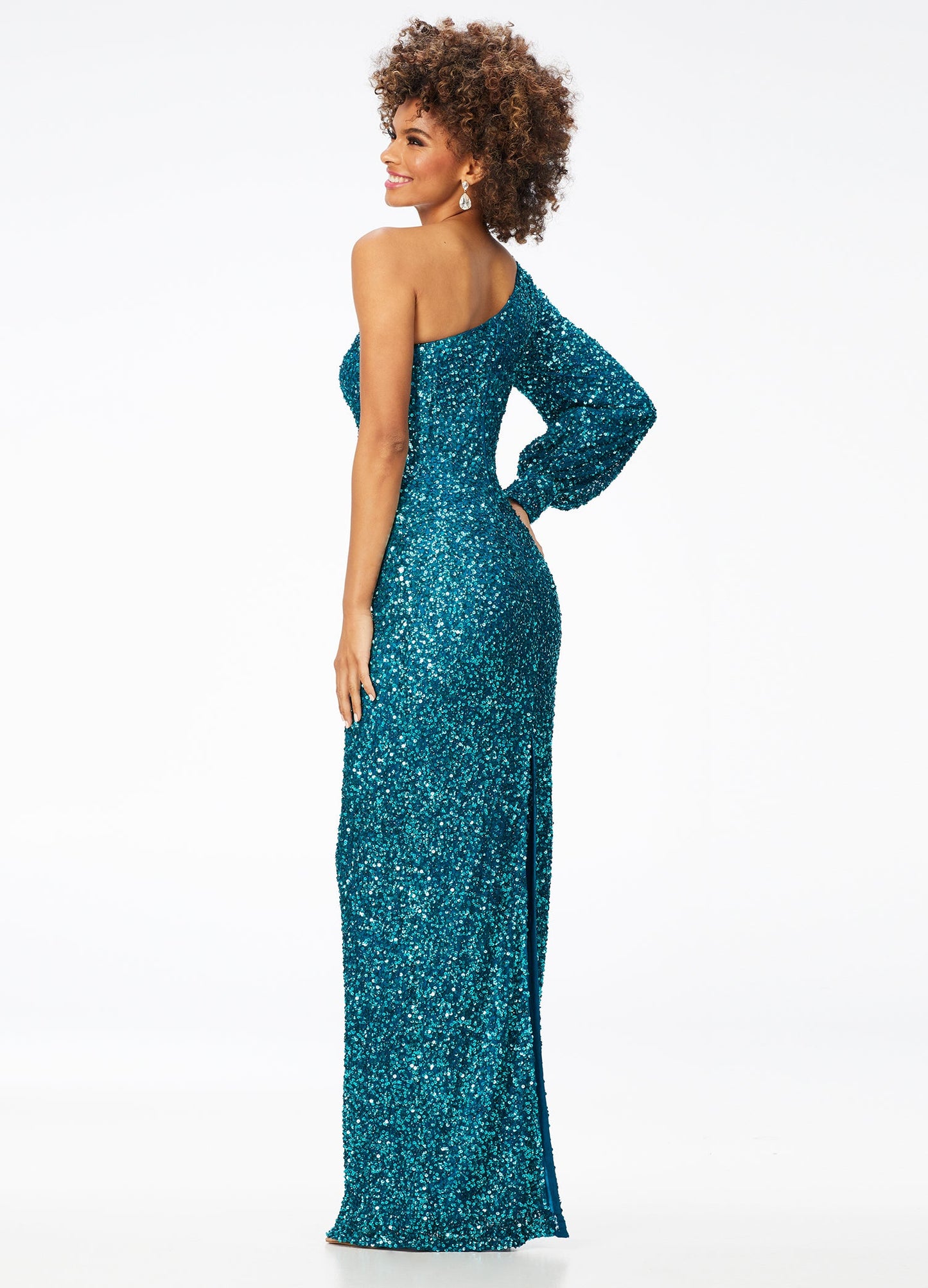 Ashley Lauren 11194  This gorgeous sequin gown features a one shoulder neckline dress features a bishop sleeve and a fitted column skirt with back vent.  Available colors:  Neon Pink, Peacock, Purple, Emerald, Black