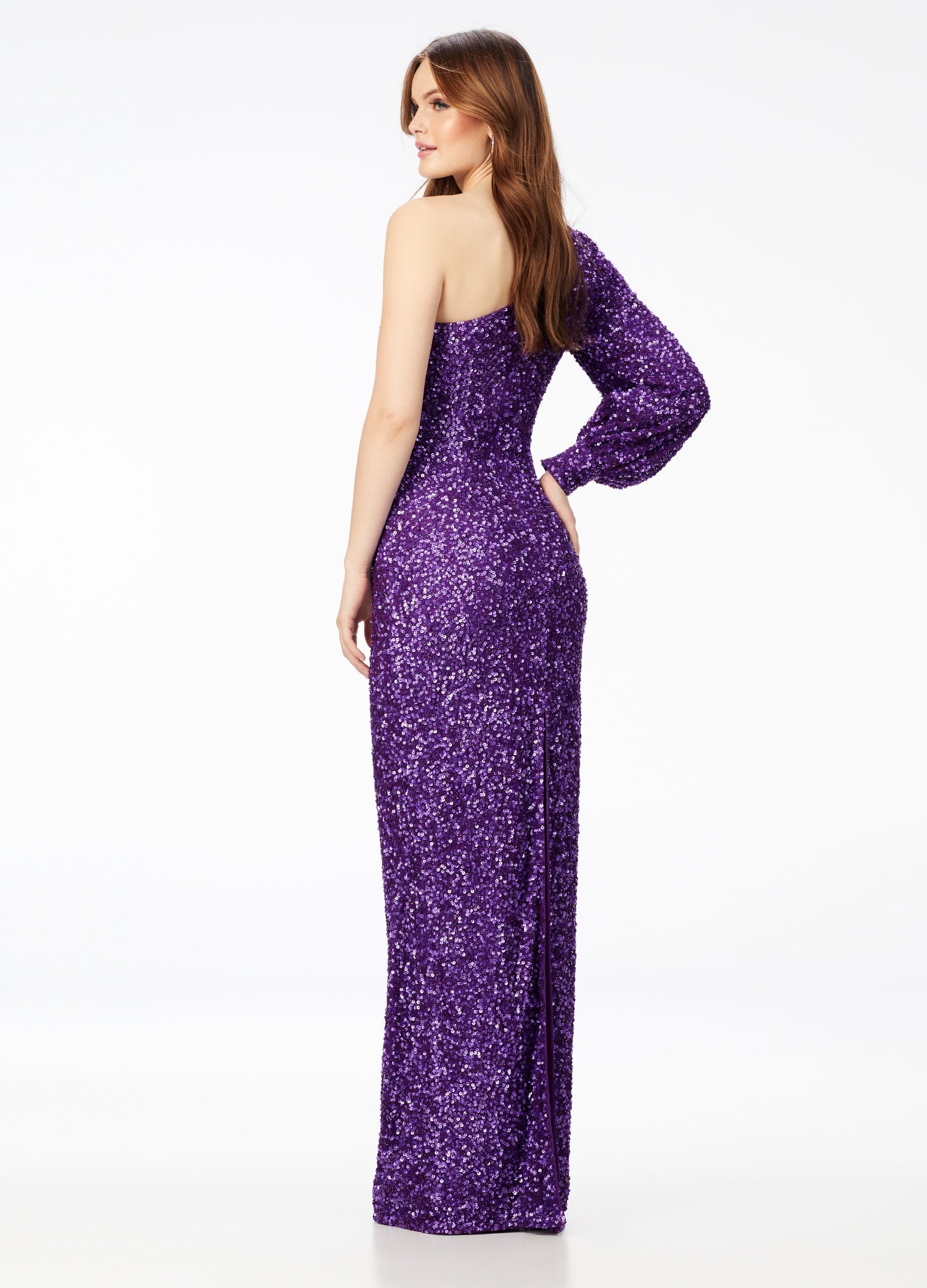 Ashley Lauren 11194  This gorgeous sequin gown features a one shoulder neckline dress features a bishop sleeve and a fitted column skirt with back vent.  Available colors:  Neon Pink, Peacock, Purple, Emerald, Black