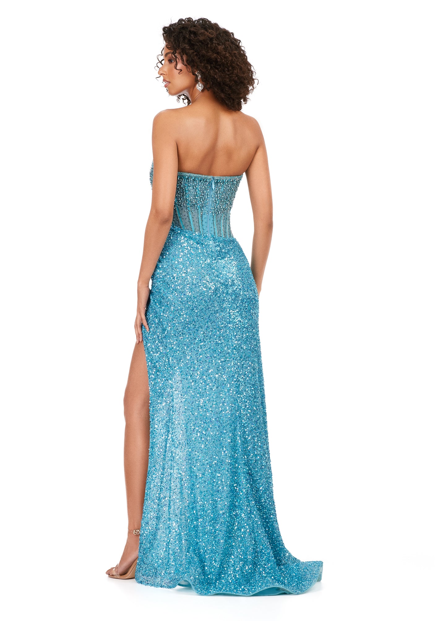 Ashley Lauren 11238 Feel like a celebrity in this jaw-dropping strapless dress. This fitted evening gown has stunning crystal beadwork on the bodice and is paired with a decadent fully beaded wrap skirt.