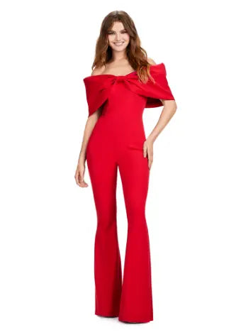 Make a statement at your next formal event with the Ashley Lauren 11414 Off Shoulder Scuba Jumpsuit. Its stylish off-shoulder design and oversized bow add a touch of elegance, while the scuba material provides a comfortable and flattering fit. Perfect for prom or any special occasion. Turn heads in this jumpsuit! This look is complete with an oversized bow off shoulder neckline.