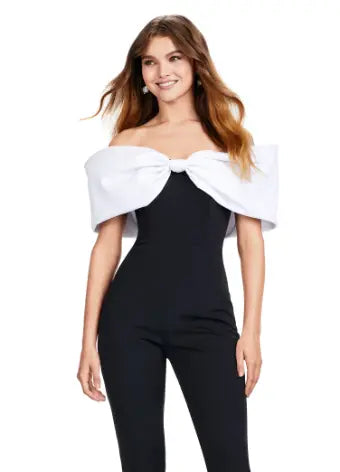 Make a statement at your next formal event with the Ashley Lauren 11414 Off Shoulder Scuba Jumpsuit. Its stylish off-shoulder design and oversized bow add a touch of elegance, while the scuba material provides a comfortable and flattering fit. Perfect for prom or any special occasion. Turn heads in this jumpsuit! This look is complete with an oversized bow off shoulder neckline.