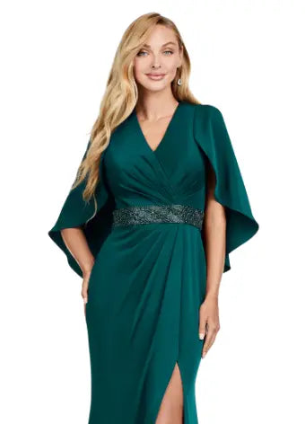 Discover elegance and sophistication with the Ashley Lauren 11416 Long Prom Dress. Made from crepe fabric and adorned with a beaded belt, this dress boasts a sleek and modern look. With an overlay and slit, it is perfect for formal occasions or pageants. Stand out in style and confidence. Dazzle all night in this elegant evening gown. The ruched V-Neck bustier is adorned with a beaded belt and a modern overlay. The wrap skirt is complete with a left leg slit.