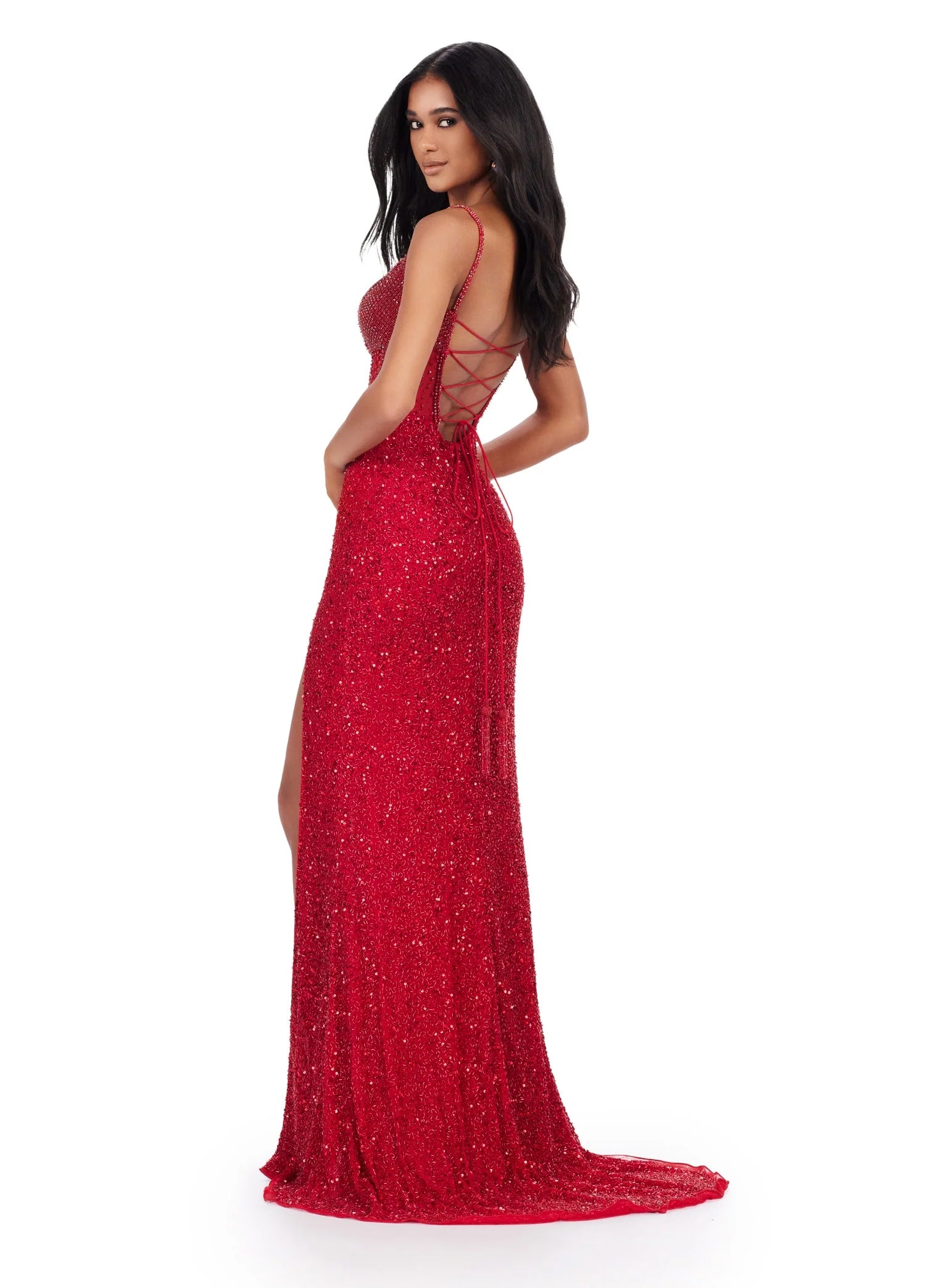 The Ashley Lauren 11448 is a stunning long gown for special occasions. It features a sequin-studded bodice with corset closure, side slit, and a backless design for a flattering silhouette. Perfect for proms, pageants, and formal events. All eyes will be on you in this fully beaded gown. The corset style bustier is embellished with crystals that are sure to dazzle. The left leg slit and lace up back complete the look. 