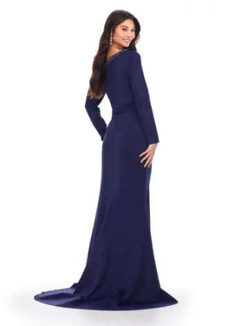 Feel like a queen in the Ashley Lauren 11450 Long Prom Dress. This stunning gown features a long sleeve scuba design, adorned with intricate beadwork and an asymmetrical neckline. Perfect for a formal event or pageant, this dress exudes elegance and sophistication. Can you say chic? This classic long sleeve scuba gown features an asymmetric beaded neckline that is perfect for your next event.