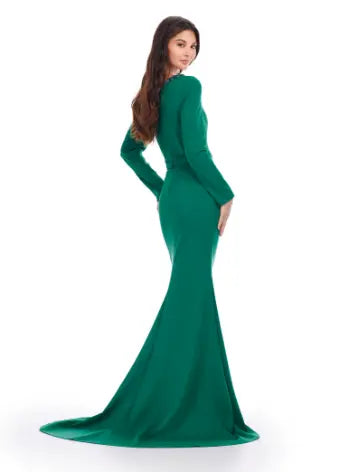 Feel like a queen in the Ashley Lauren 11450 Long Prom Dress. This stunning gown features a long sleeve scuba design, adorned with intricate beadwork and an asymmetrical neckline. Perfect for a formal event or pageant, this dress exudes elegance and sophistication. Can you say chic? This classic long sleeve scuba gown features an asymmetric beaded neckline that is perfect for your next event.