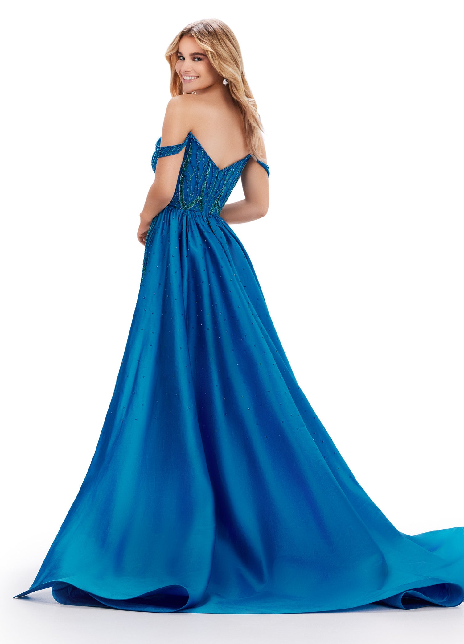 Elevate your evening look with the Ashley Lauren 11458 Long Prom Dress. This fully beaded strapless gown features a flattering off shoulder neckline and a unique draping taffeta overskirt. Perfect for formal occasions and pageants. Regal and fabulous? We got you. This fully beaded gown features an off shoulder sweetheart neckline and a dramatic taffeta overskirt to help you slay at your next event.