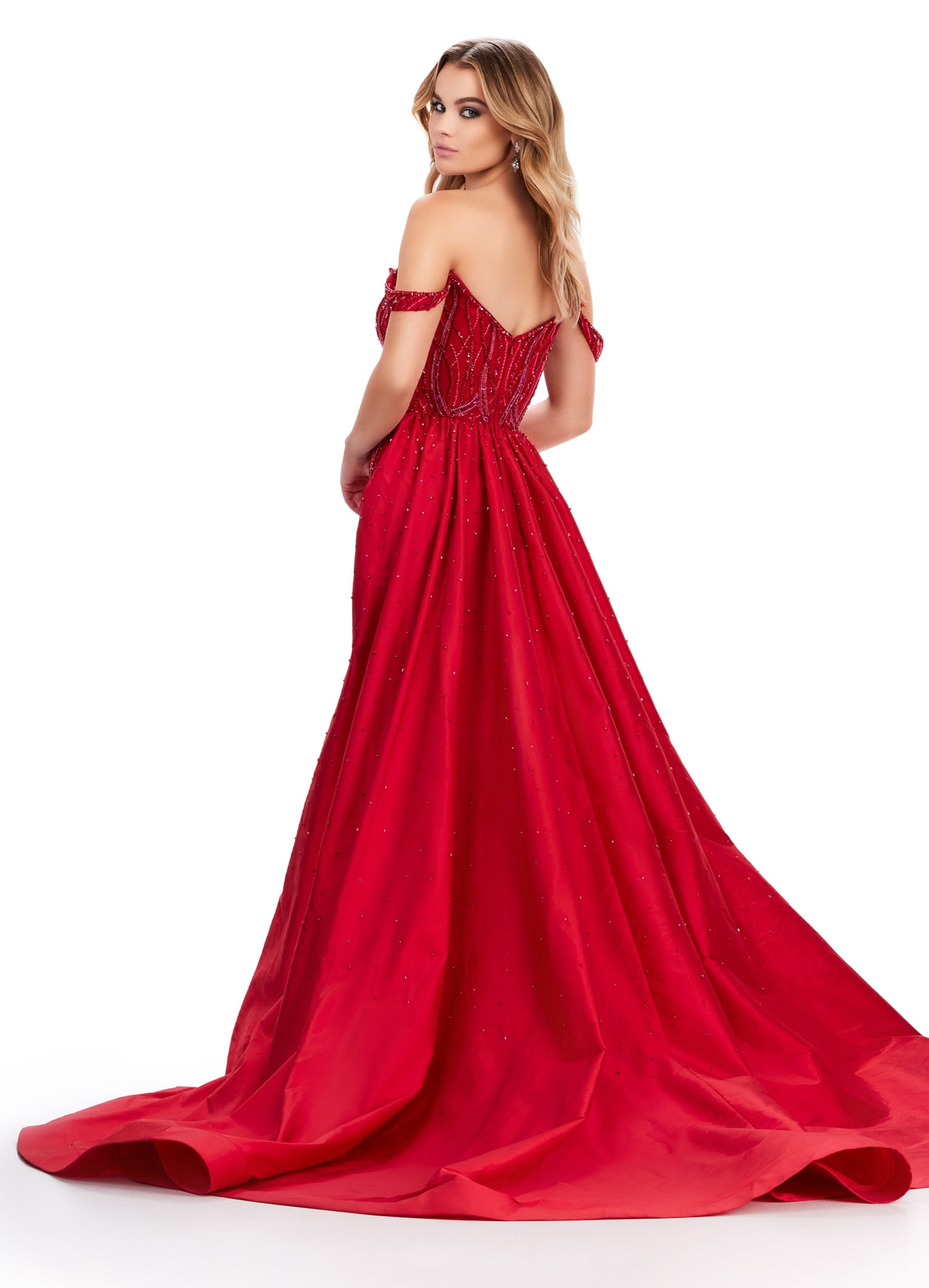 Elevate your evening look with the Ashley Lauren 11458 Long Prom Dress. This fully beaded strapless gown features a flattering off shoulder neckline and a unique draping taffeta overskirt. Perfect for formal occasions and pageants. Regal and fabulous? We got you. This fully beaded gown features an off shoulder sweetheart neckline and a dramatic taffeta overskirt to help you slay at your next event.