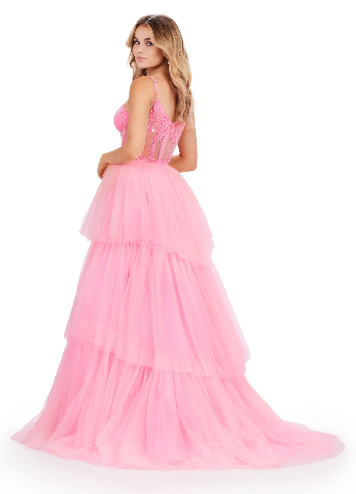 The Ashley Lauren 11462 Sheer Beaded Corset Layer Tulle Prom Dress Ballgown Pageant Tiered Gown is a statement-making piece. Crafted from sheer corset layers, delicate beadwork, and tiered tulle, it's perfect for any special occasion. Elegant and eye-catching, this dress features the perfect balance of comfort and sophistication.