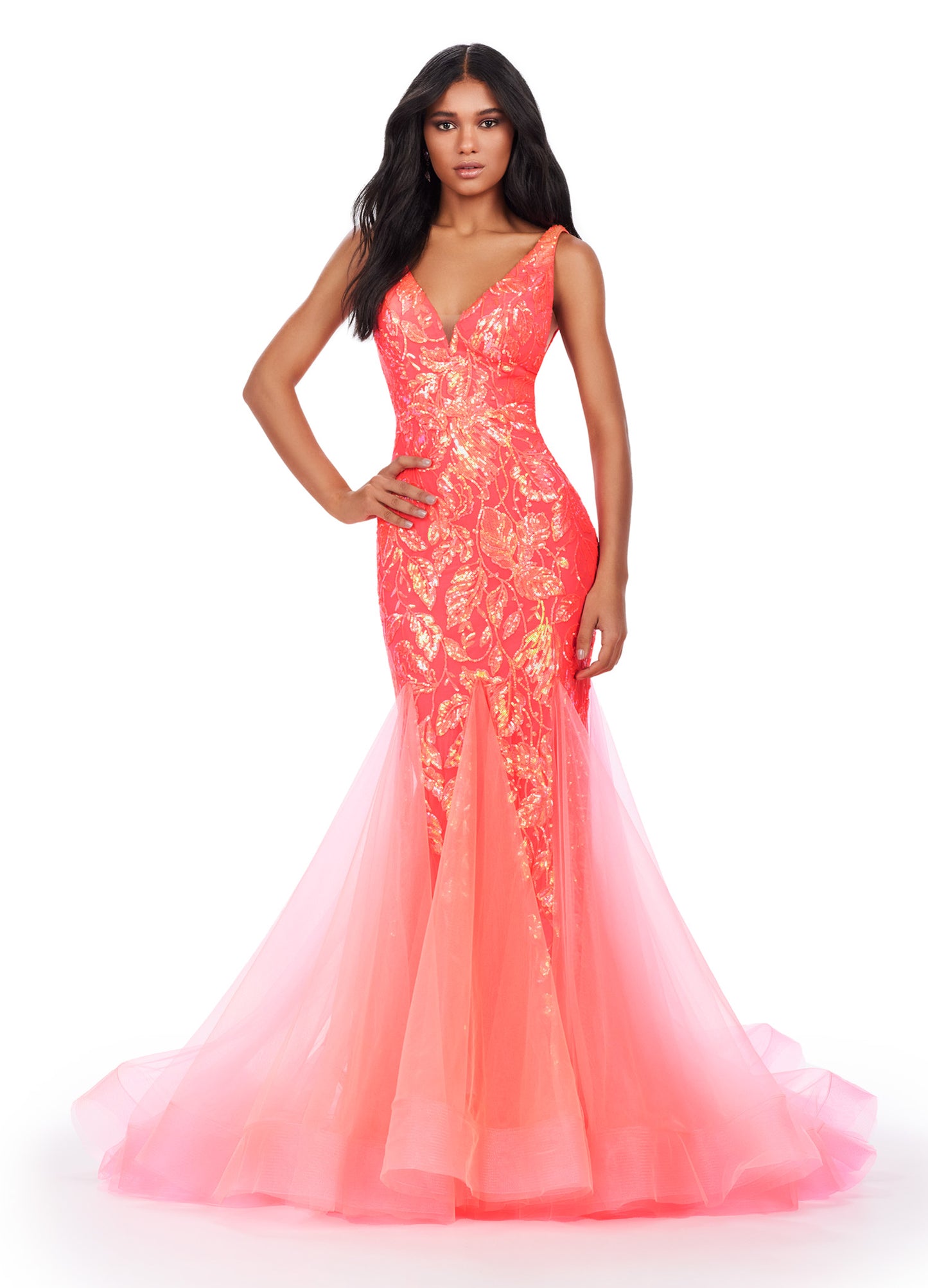 Get ready to command attention in the Ashley Lauren 11472 Long Prom Dress. With a stunning V-neck, sequin embellishments, and a mermaid skirt made with stretchy fabric, this gown is designed to enhance your figure and make you shine. Perfect for formal events, pageants, and more. Can you say iconic? This stretch sequin gown features a v-neckline and a pleated tulle skirt to help you slay your next event.