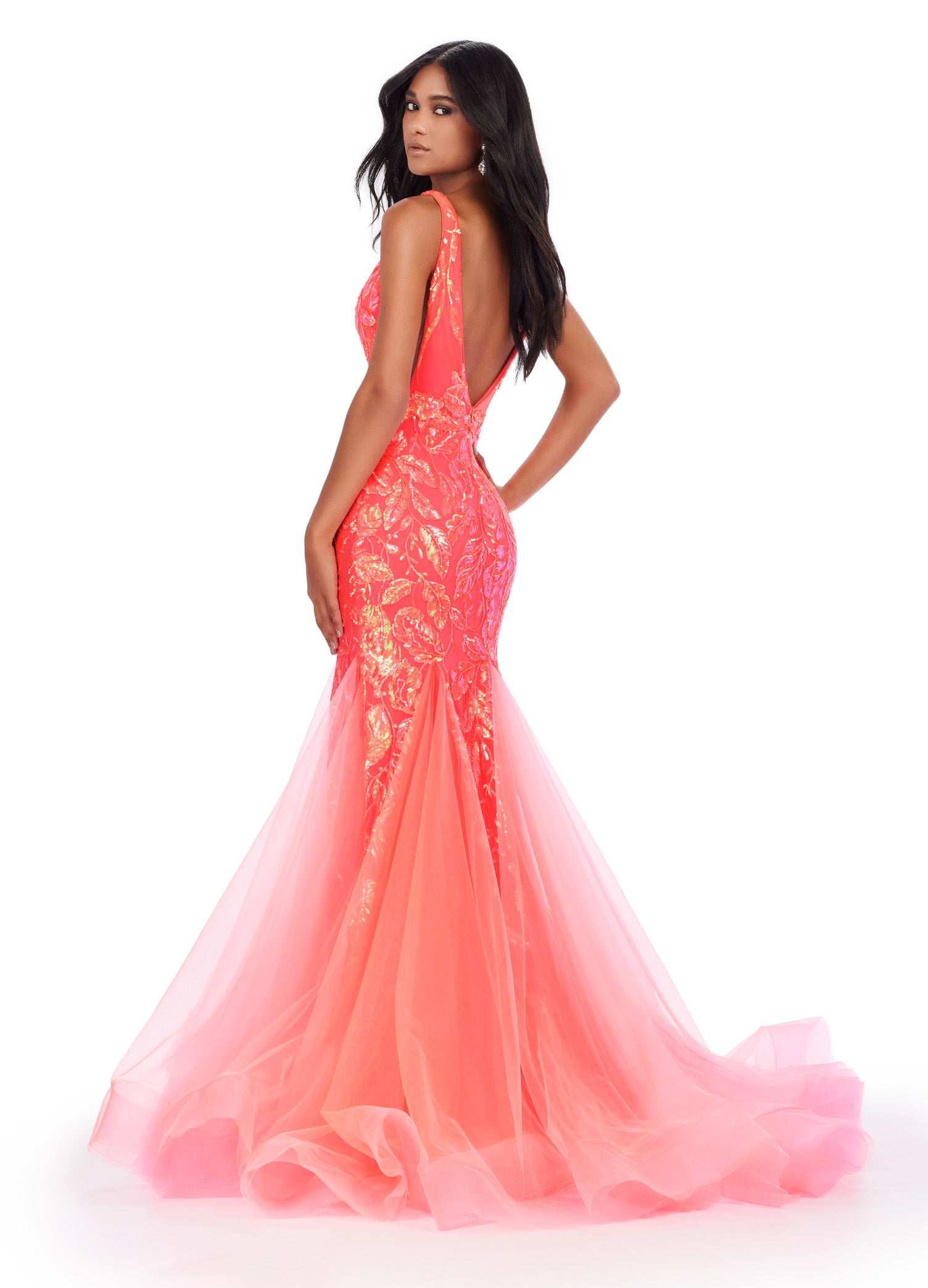 Get ready to command attention in the Ashley Lauren 11472 Long Prom Dress. With a stunning V-neck, sequin embellishments, and a mermaid skirt made with stretchy fabric, this gown is designed to enhance your figure and make you shine. Perfect for formal events, pageants, and more. Can you say iconic? This stretch sequin gown features a v-neckline and a pleated tulle skirt to help you slay your next event.