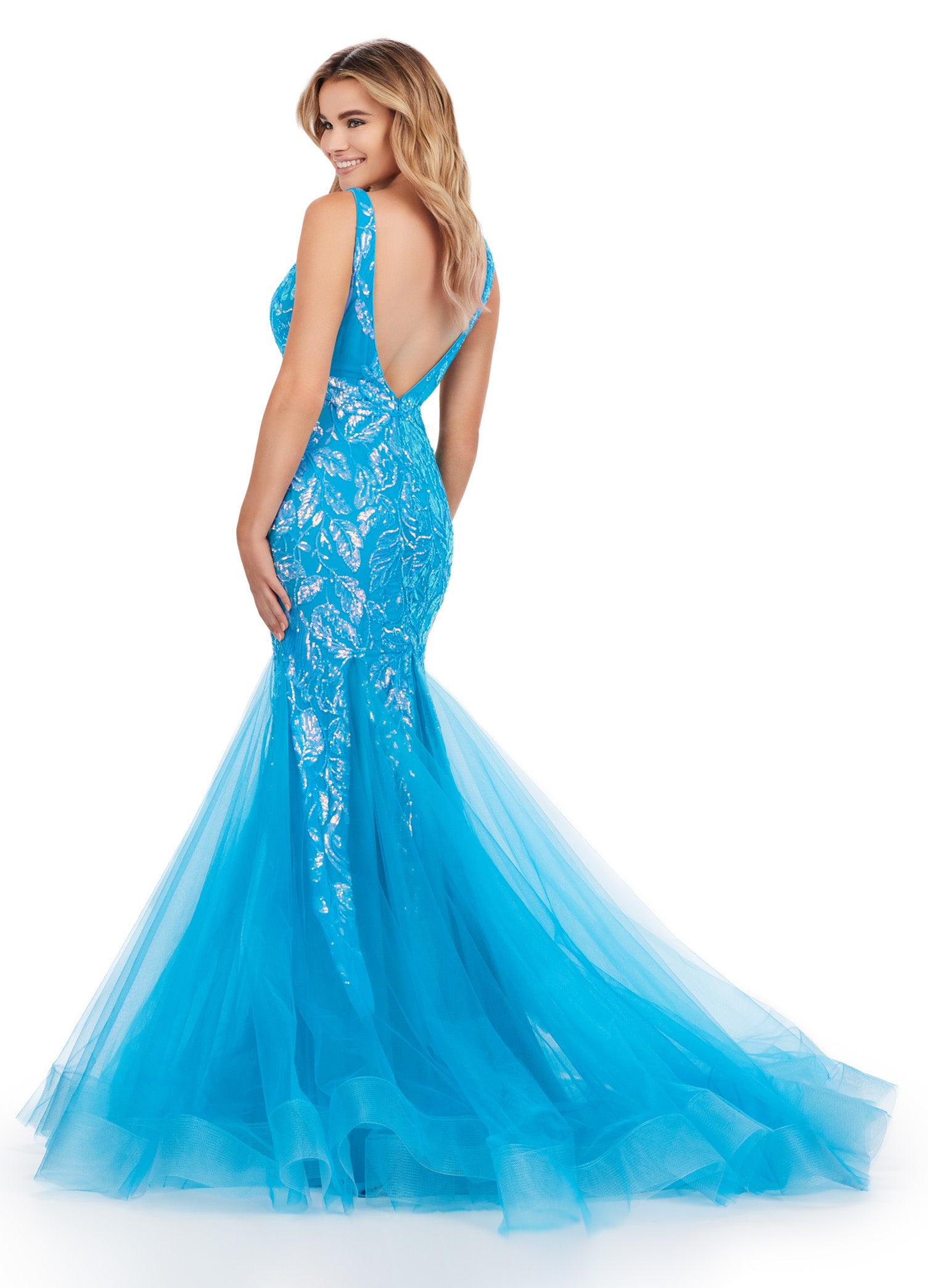 Get ready to command attention in the Ashley Lauren 11472 Long Prom Dress. With a stunning V-neck, sequin embellishments, and a mermaid skirt made with stretchy fabric, this gown is designed to enhance your figure and make you shine. Perfect for formal events, pageants, and more. Can you say iconic? This stretch sequin gown features a v-neckline and a pleated tulle skirt to help you slay your next event.