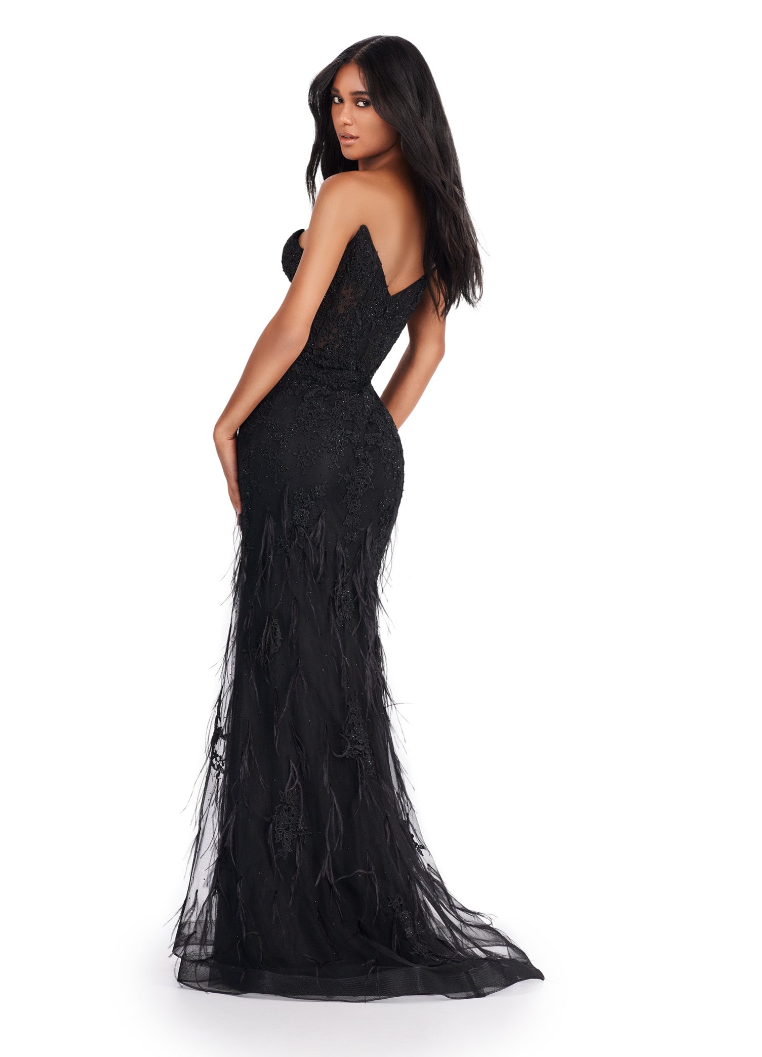 Elevate your elegance with the Ashley Lauren 11483 Long Prom Dress. This striking gown features a corset bodice, strapless design, and exquisite embroidered details. The v-neckline adds a touch of allure while the feather details bring a playful element. Perfect for formal events or pageants. Slay the night away in this lace embroidered gown. This dress features a strapless neckline and feathers throughout to help you feel fabulous.