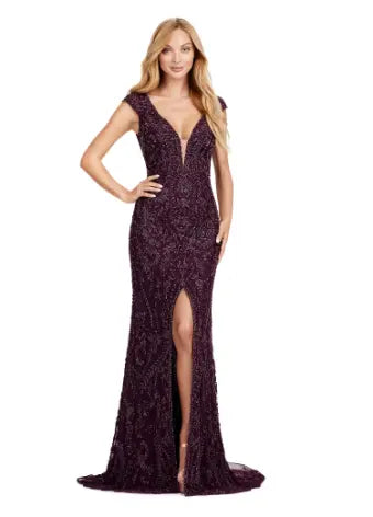 Elevate your formal style with the Ashley Lauren 11497 Fully Beaded V-Neck Evening Gown. The intricate beading, cap sleeves, and center slit create a stunning silhouette that will surely make a statement. Perfect for special occasions, this gown exudes elegance and sophistication. This fully beaded gown is perfect for your next event. This elegant dress features cap sleeves and a V-Neckline with a center slit to compliment the look.