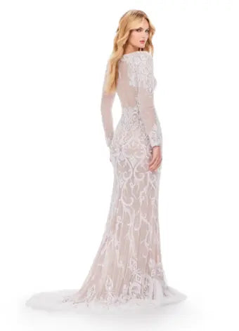 This elegant Ashley Lauren 11507 Long Prom Dress features a long sleeve beaded gown with an illusion open back, perfect for formal occasions and pageants. The intricate beading adds a touch of luxury while the open back adds a hint of allure. Make a statement with this stunning dress. his classic long sleeve fully beaded gown features a v neckline and illusion open back. The details on the train complete the look.