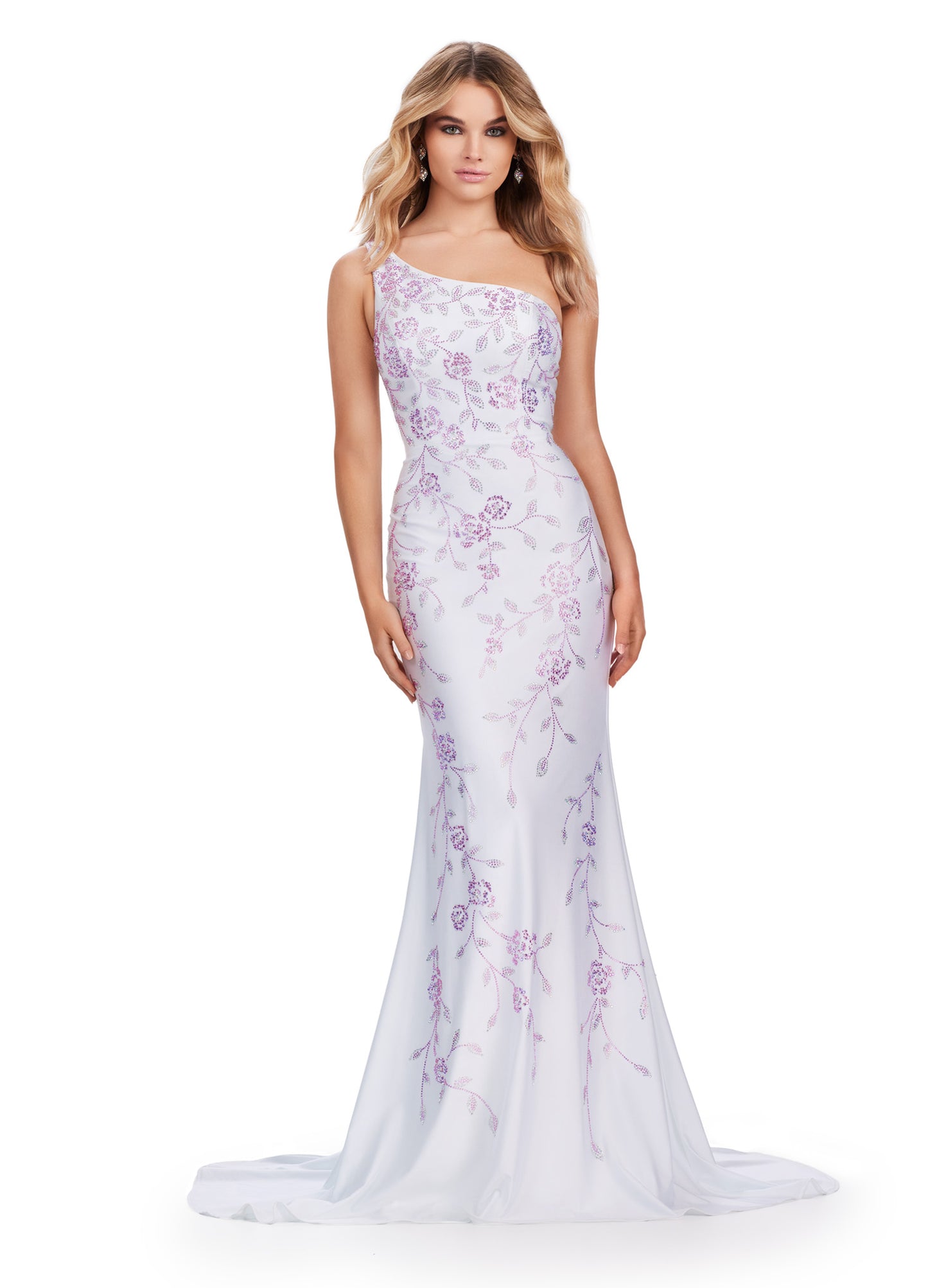 Make a stunning entrance in the Ashely Lauren 11525 Long Prom Dress. Featuring a one shoulder design and a press on floral bead pattern, this gown exudes sophistication and elegance. The jersey fabric offers a comfortable and flattering fit, perfect for any formal occasion. Make a statement in this pageant-worthy gown. This one shoulder jersey gown features a delicate multi-colored heat set stone floral bead pattern that cascades down onto the skirt.