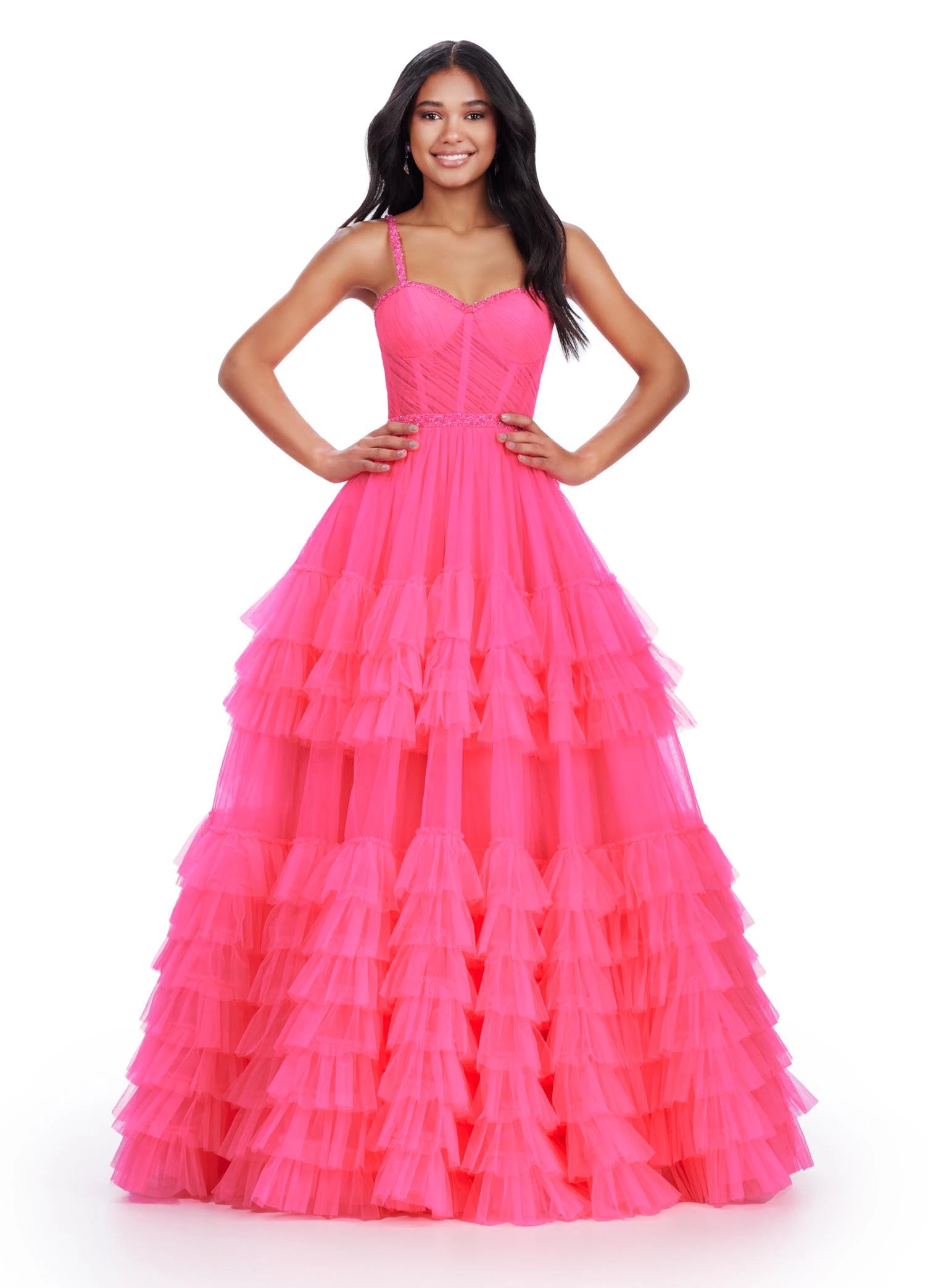 The Ashley Lauren11603 Long Tulle Ruffle Layer Ballgown Prom Dress is the perfect choice for your special occasion. With a beaded corset and ruffled layers for movement, this gown adds the perfect amount of glamour and elegance.