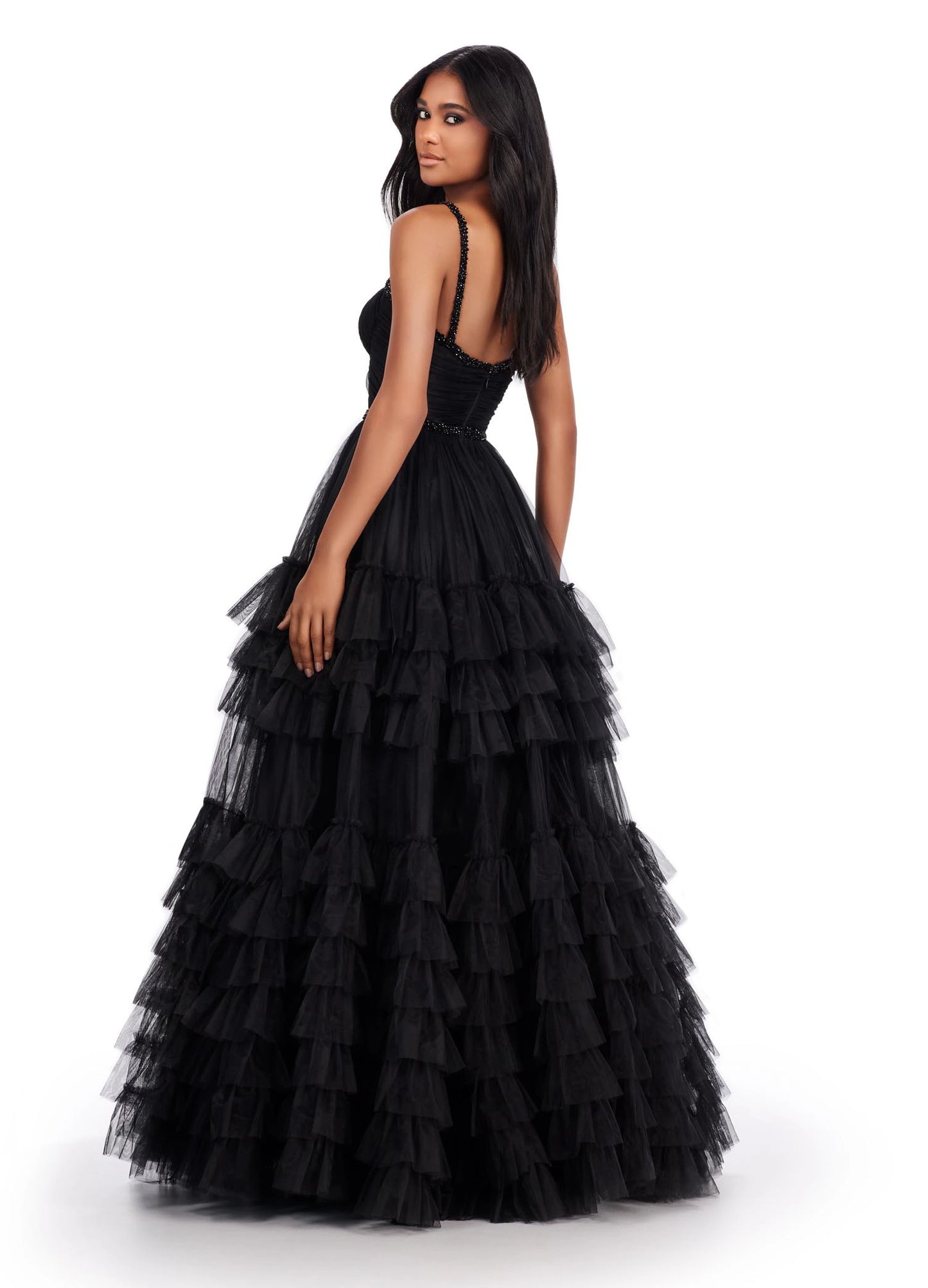 The Ashley Lauren11603 Long Tulle Ruffle Layer Ballgown Prom Dress is the perfect choice for your special occasion. With a beaded corset and ruffled layers for movement, this gown adds the perfect amount of glamour and elegance.