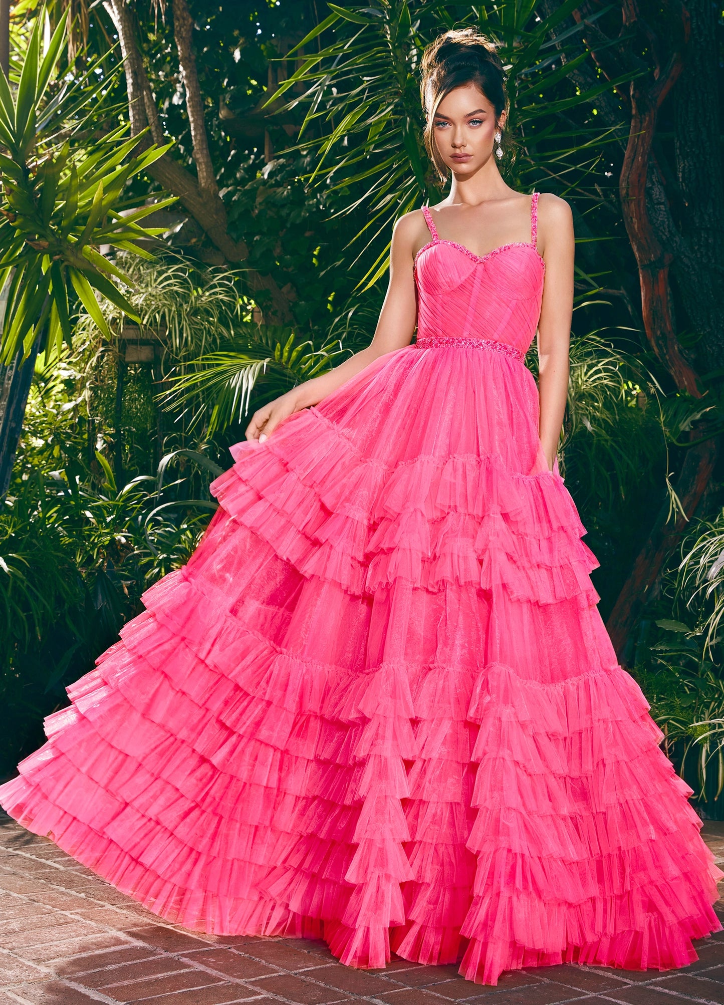 The Ashley Lauren11603 Long Tulle Ruffle Layer Ballgown Prom Dress is the perfect choice for your special occasion. With a beaded corset and ruffled layers for movement, this gown adds the perfect amount of glamour and elegance.