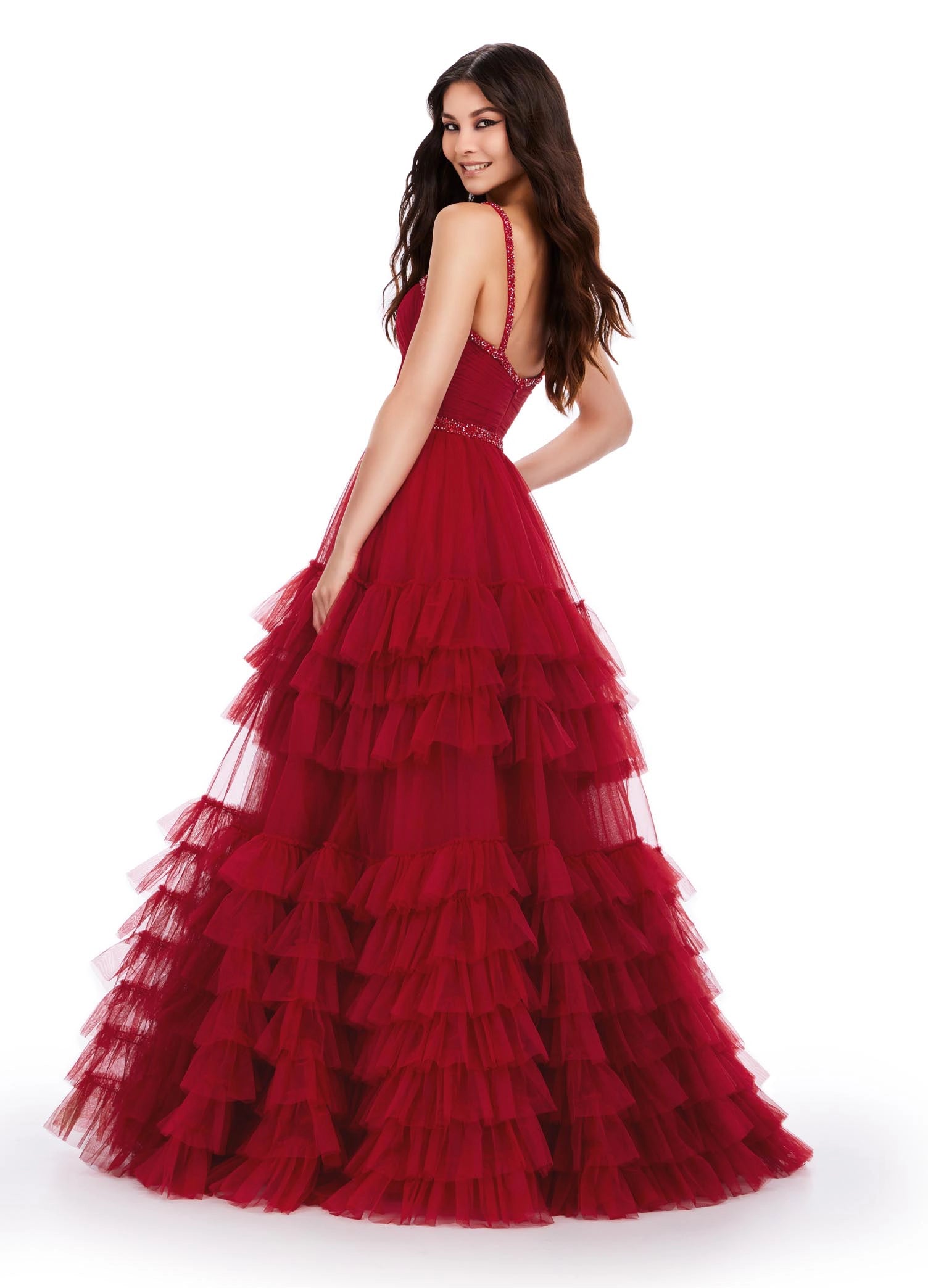 The Ashley Lauren11603 Long Tulle Ruffle Layer Ballgown Prom Dress is the perfect choice for your special occasion. With a beaded corset and ruffled layers for movement, this gown adds the perfect amount of glamour and elegance.