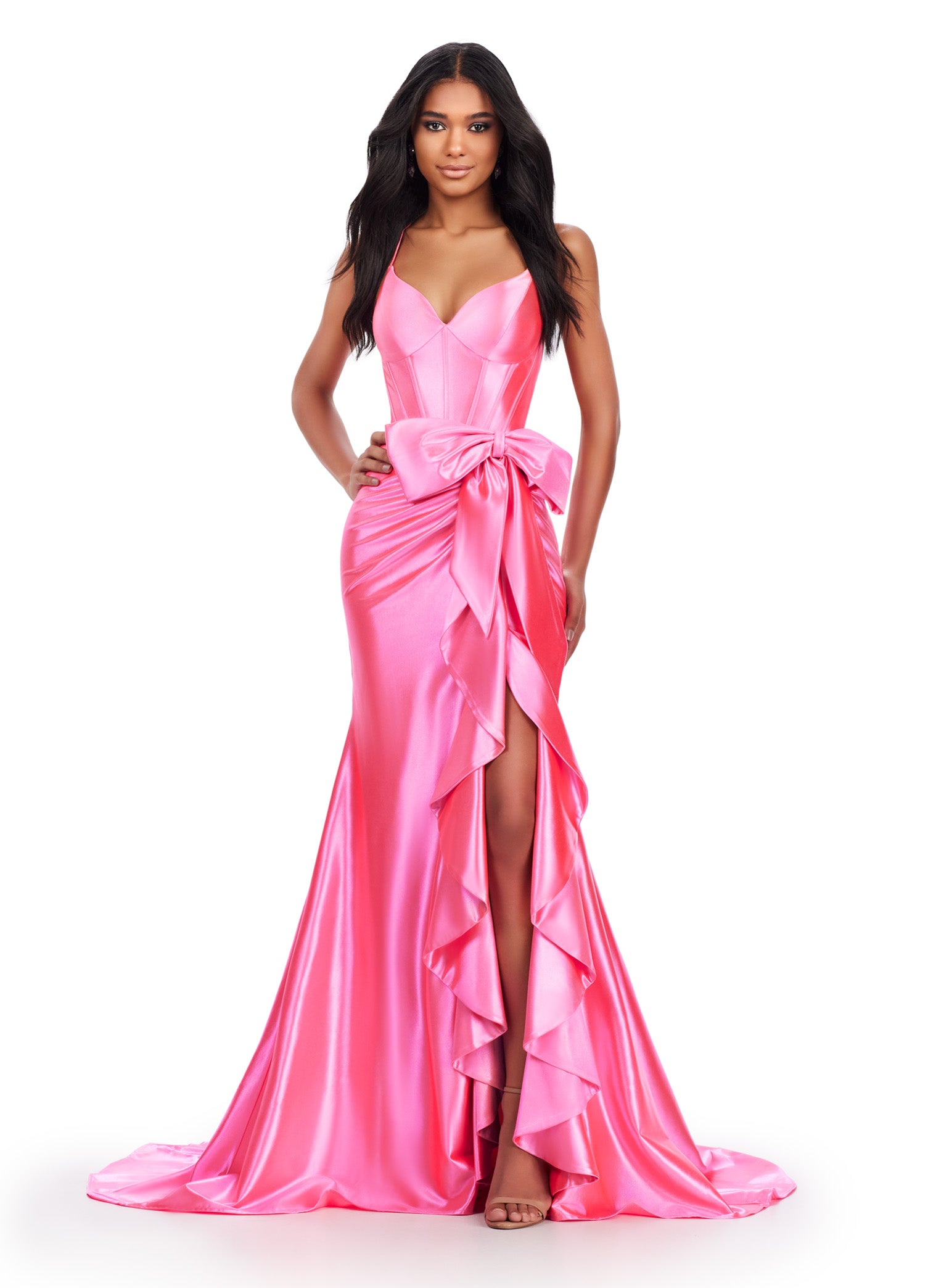 Be the belle of the ball in the Ashley Lauren 11638 Long Prom Dress. Featuring a corset top and spaghetti straps, this stunning gown exudes elegance. The cascading bow and ruffle details add a touch of drama, making it the perfect choice for any formal event or pageant. Edgy and fabulous! This shimmer jersey gown features a corset bodice with a bow and cascading ruffle detail. The lace up back and spaghetti straps make this extra fab.