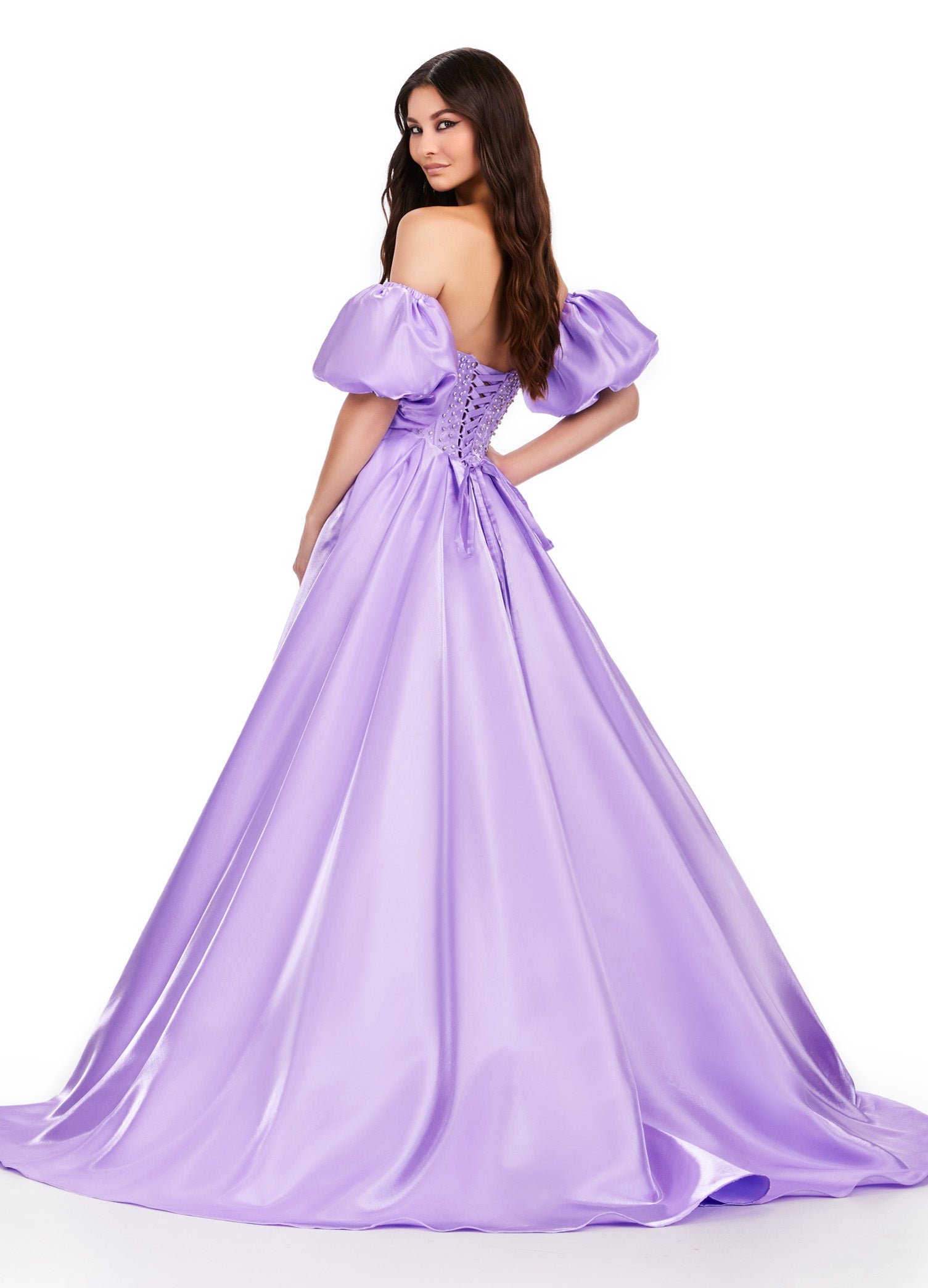 Elevate your formalwear with the Ashley Lauren 11642 prom dress. The luxurious satin fabric, sweetheart neckline, and crystal corset add elegance and charm to this A-line ballgown. The puff sleeves bring a touch of drama and playfulness to your look. Perfect for prom or pageants. A satin ball gown fit for a queen. This strapless dress features a beaded corset bodice with detachable puff sleeves and a lace up back.