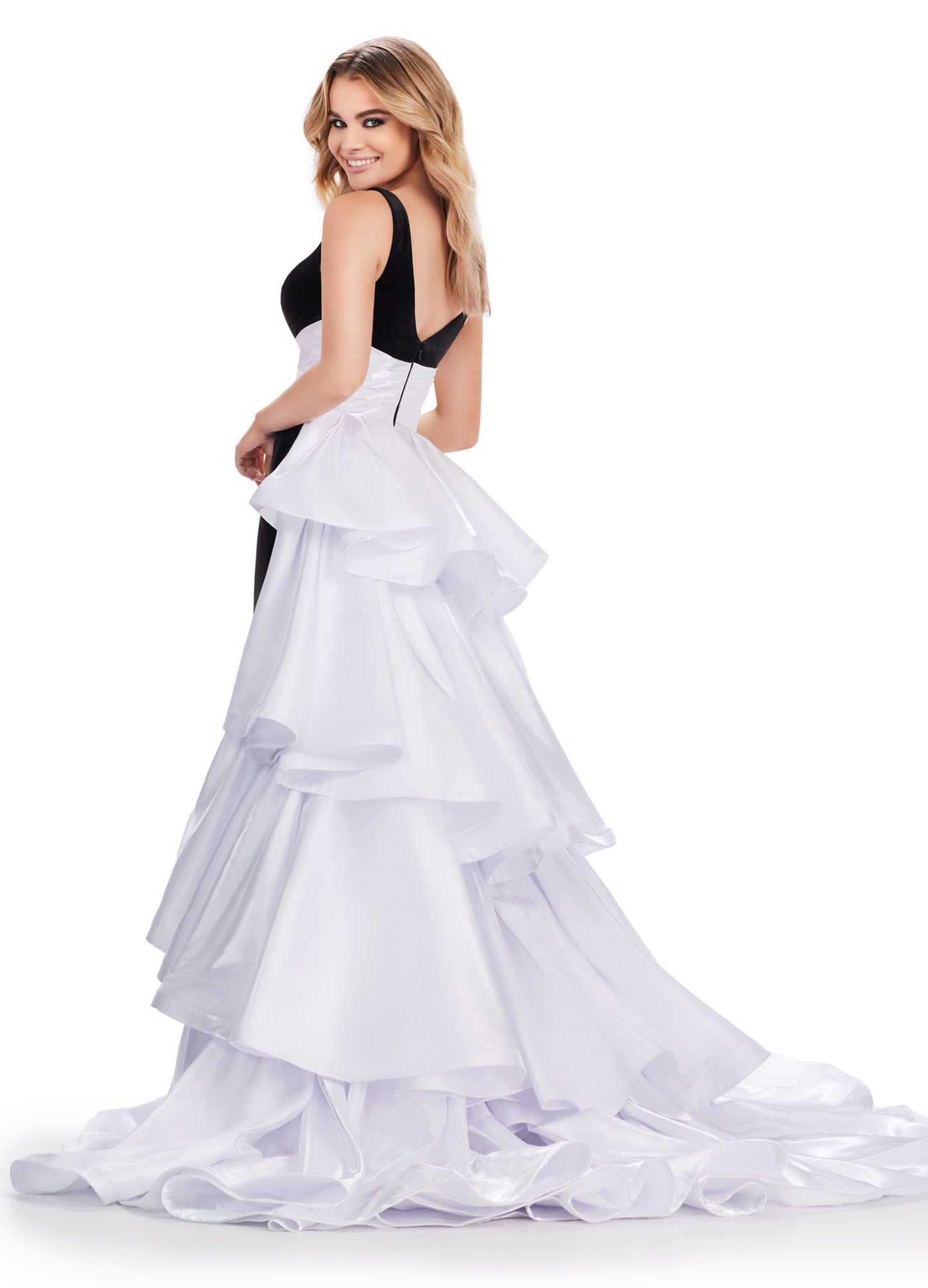 Be the belle of the ball in the Ashley Lauren 11643 Long Prom Dress. Made with luxurious velvet and satin, this fitted gown features a sophisticated V neck and a stunning ruffled overskirt. Perfect for any formal event or pageant, this gown exudes elegance and grace. This stunning velvet gown is perfect for your next event. This unique v neckline gown features a gorgeous ruffled heavy satin overskirt.