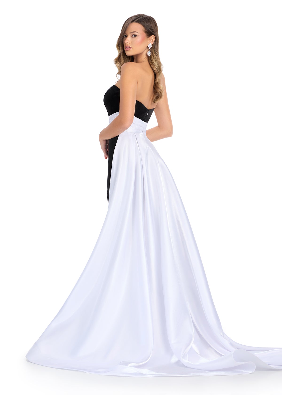 Elevate your formal wear with the Ashley Lauren 11857 Long Fitted Velvet Pageant Dress. Crafted from luxurious velvet, this gown is tailored to accentuate your figure. The elegant satin overskirt adds a touch of sophistication, making it perfect for any formal occasion. Make a statement with this stunning evening gown.&nbsp;We are obsessed with this classic strapless velvet dress with a left leg slit. The dress is finished with a gorgeous satin overskirt sinching the waist and oozing elegance.

Strapless Ne