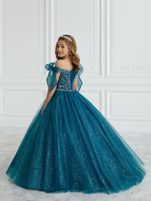 This Tiffany Princess pageant dress Style 13677 features a stunning A-line design with intricate beading and glitter details. The tulle ball gown is completed with delicate off the shoulder neckline accented by bows for added elegance. Perfect for formal events, this dress will make your little girl feel like a princess. Corset Back