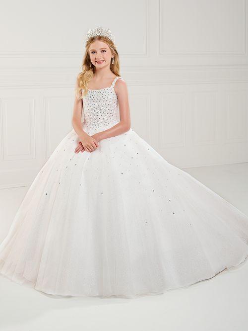 This Tiffany Princess 13739 Girls Pageant Dress is the perfect choice for preteens. The tulle material adds volume to the A-line corset ball gown while the pearl beading adds a touch of elegance. The dress is designed to make your little one stand out on stage. <span data-mce-fragment="1">Square neckline, pearls and Rhinestone fully beaded bodice, and tulle ball gown skirt. Lace-up back and sweep train.</span>