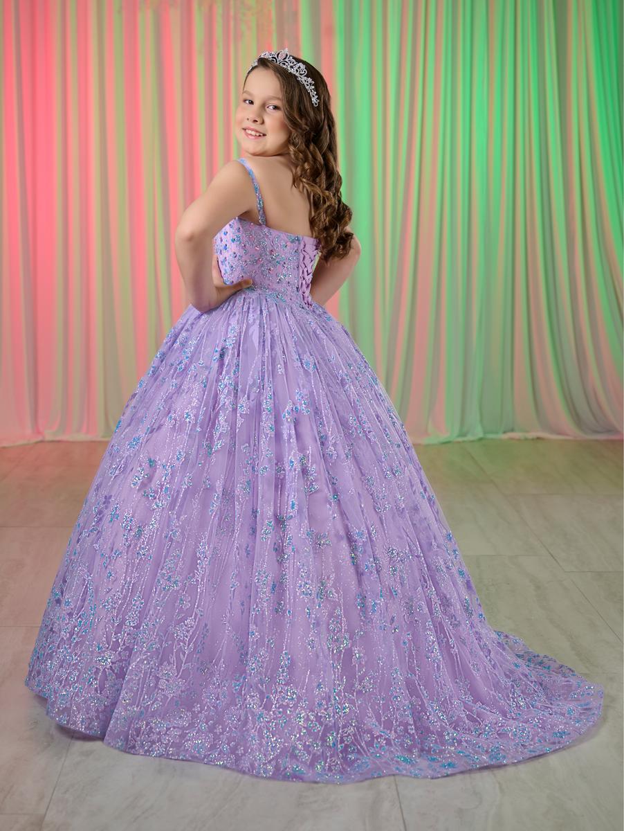 Get ready to dazzle in the Tiffany Princess 13755 Girls Glitter Pageant Dress. Featuring a long ball gown style with a sparkling sequin corset, this dress will make you shine like a star on stage. Be the center of attention and feel like royalty in this formal dress.