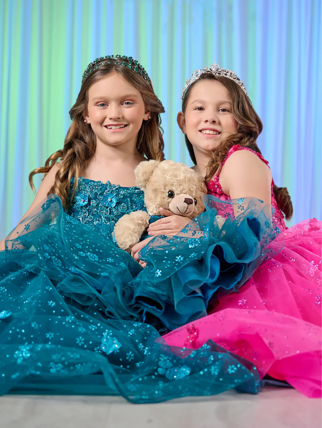 Dress your little princess like royalty with our Tiffany Princess 13758 Long Lace Pageant Dress. The stunning scoop neckline and spaghetti straps enhance a regal look. Adorned with 3D floral and glitter details, the tulle ball gown skirt adds a touch of elegance. The lace-up back and sweep train complete the fairytale feel of this dress.