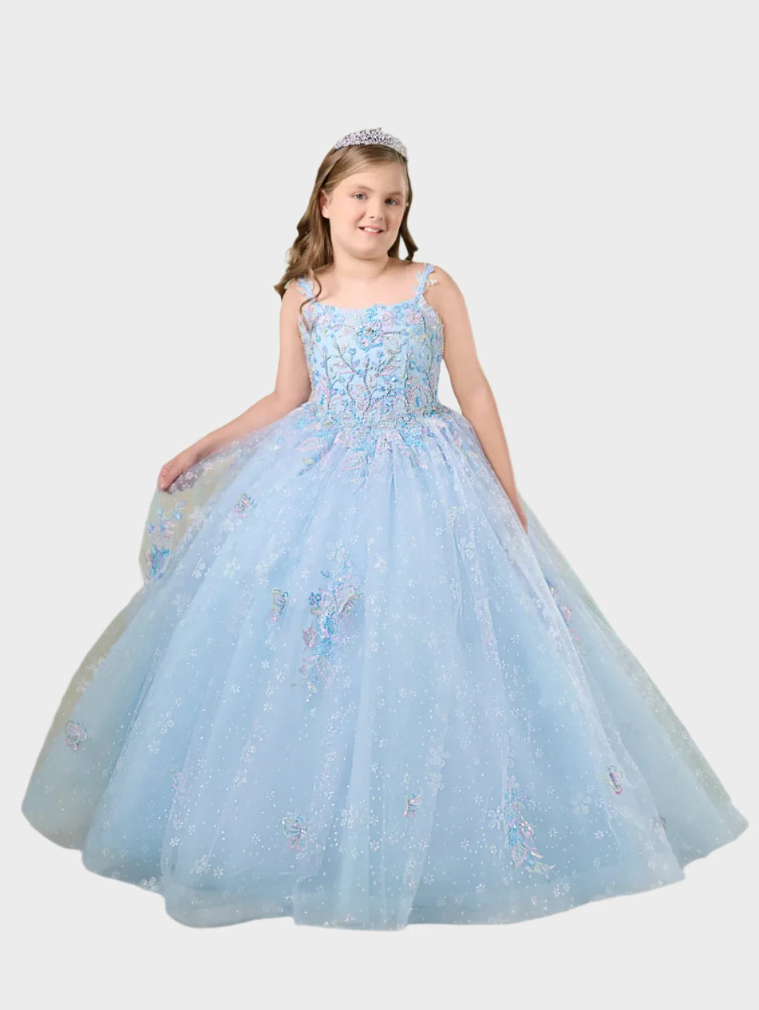 Elevate your little princess's pageant look with the Tiffany Princess 13759 Girls Pageant Dress. The delicate spaghetti straps frame a scoop neckline adorned with sparkling crystals. The beaded bodice is beautifully accented with lace appliqués, while the multi-layered tulle and snowflake glitter tulle ball gown skirt features stunning butterfly embroidery.