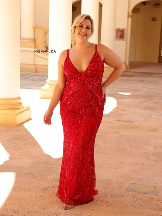 Be the star of the night in our Primavera Couture 14044 dress. This long prom dress is designed to make you stand out, with a corset back and plunging neckline that accentuates your figure. The intricate sequin detailing adds a touch of glamour to this fitted formal gown. Own the spotlight and feel confident in this plus size dress.