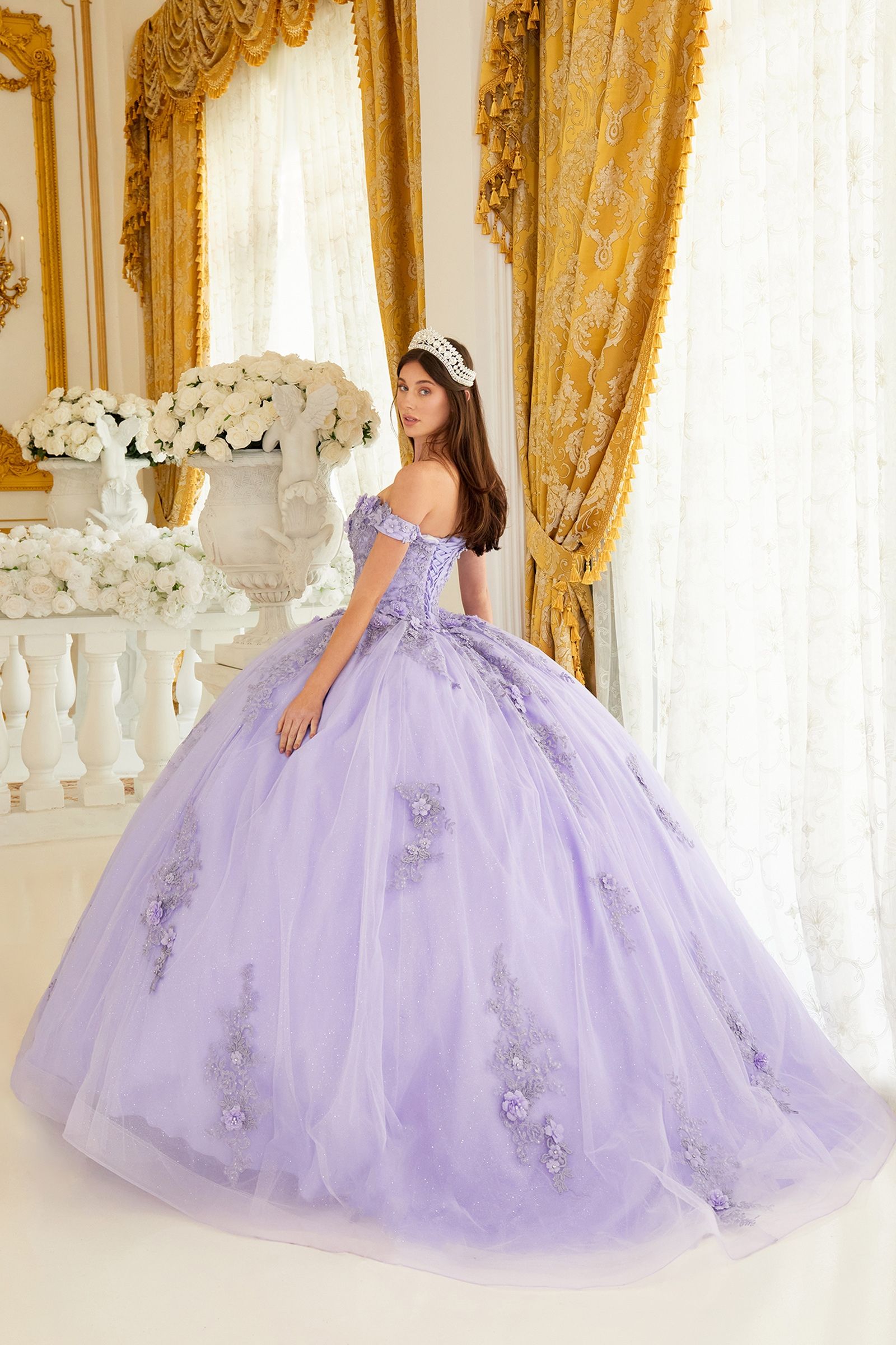 Unleash your inner princess with this Ladivine 15702 Off The Shoulder Shimmer Lace Quinceanera Ballgown Dress Formal Gown! Flaunt your radiant beauty in this romantic, glittery tulle ball gown, featuring a sweetheart neckline and off-shoulder lace and floral appliques. The gorgeous layered skirt sparkles magnificently with floral appliques, and the lace-up corset back closure ensures a perfectly tailored fit. Get ready to look like the belle of the ball!