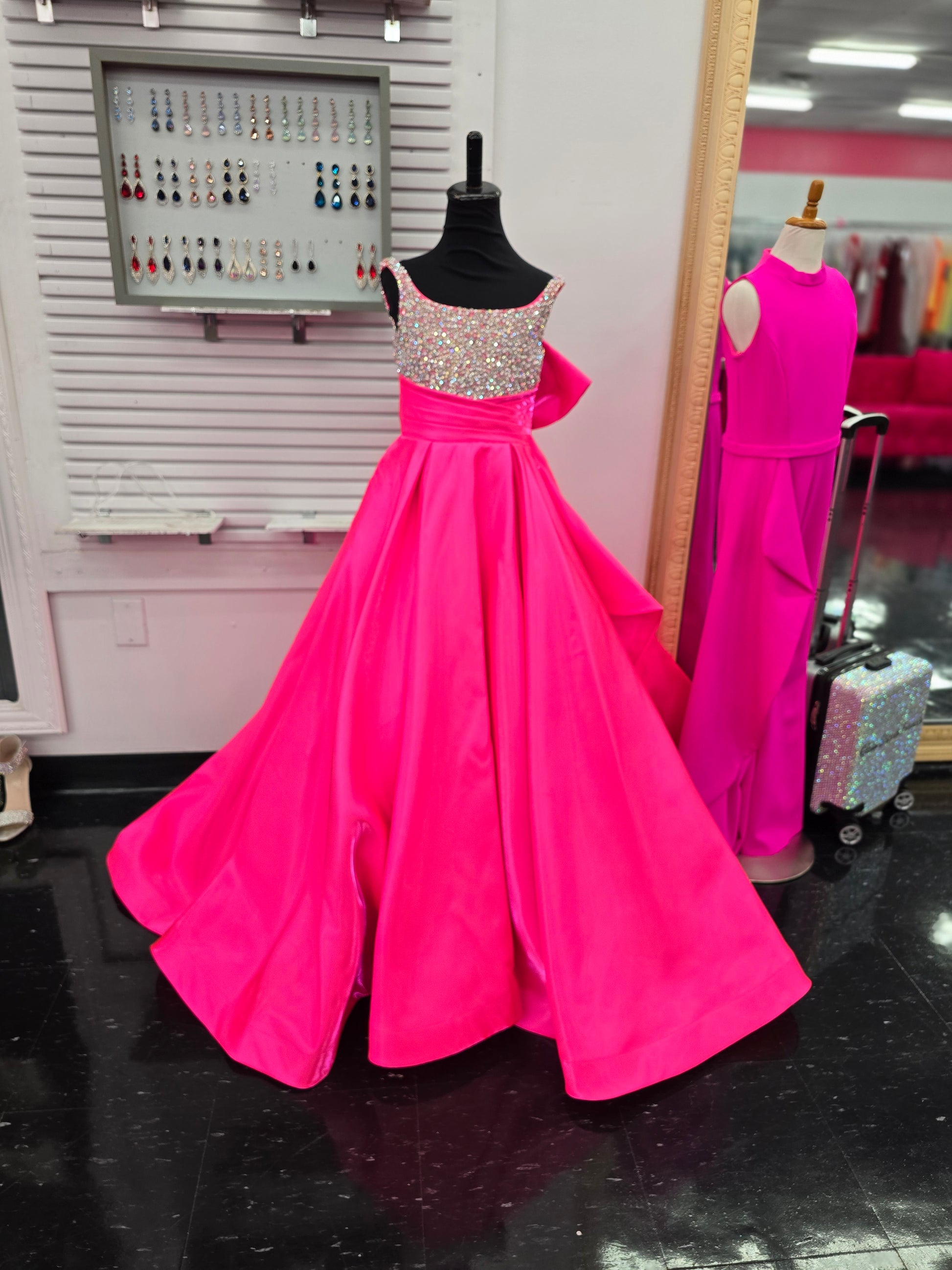 Get ready for a night to remember in the Ashley Lauren 8278 Girls Satin Ballgown. The embellished bodice and delicate spaghetti straps add a touch of elegance to this luxurious dress. Made with high-quality satin, this ballgown promises a comfortable and stunning fit for any special occasion.

Colors:&nbsp; Hot Pink, Orchid, White