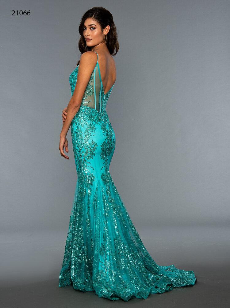 Stella Couture 21066 is a stunning V neckline glitter embellished fitted mermaid prom & Pageant Dress. Featuring a corset design bodice with boning and a v neckline. Lush mermaid silhouette with a sweeping train. sheer back. Great for Prom & Pageant  Available Size: 0-18  Available Color: Red, Silver, Gold, Black, Turquoise, Green, Yellow, Rose, Royal, Navy, Emerald