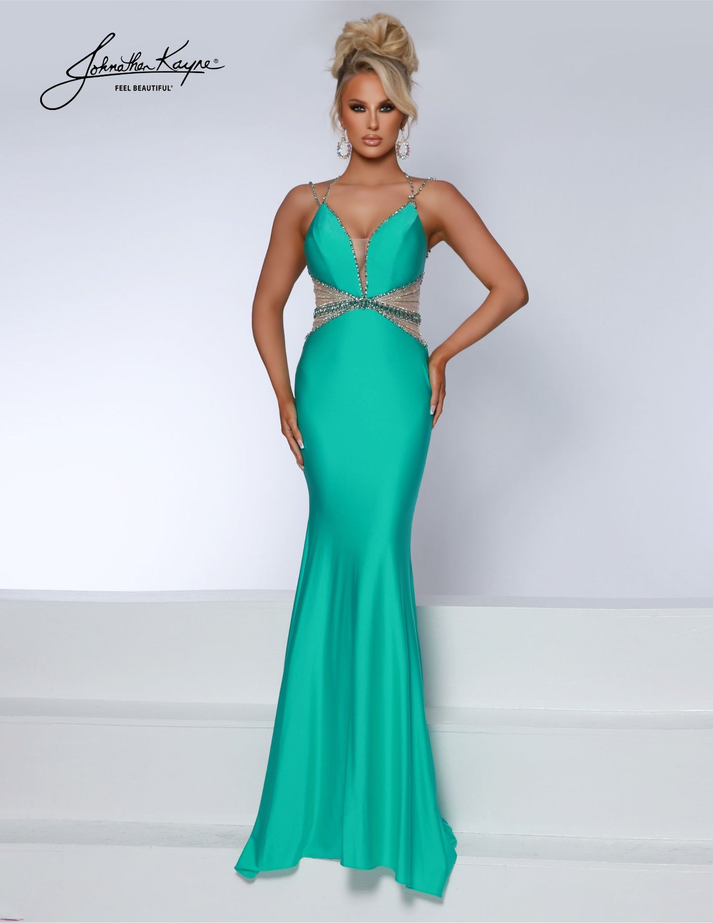 Johnathan Kayne 2808 long prom dress features a stunning beaded design, sheer side cut-outs and a deep V neckline. The perfect formal gown for pageants, dances, and special occasions. Experience elegance and comfort in this 4-Way Stretch Lycra gown. The beaded sheer side cut-outs and deep V neckline create a sultry, stylish look for any special occasion.