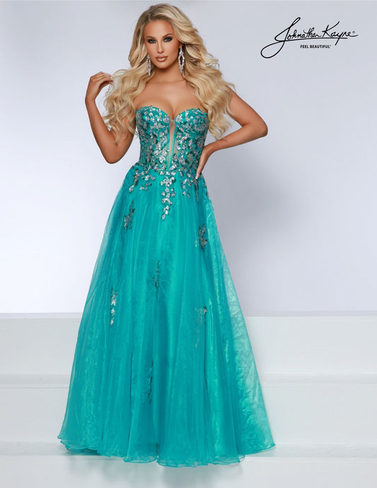 Make a statement in the Johnathan Kayne 2809 Long Prom Dress. This beautiful full-length gown features a sheer sequin corset bodice with a formal A-line skirt in a flattering silhouette. Turn heads at your prom or pageant in this stunning gown. Elegance meets untamed beauty in this ballgown. The captivating sequin detailing adds a dash of fierce to your already enchanting presence. 