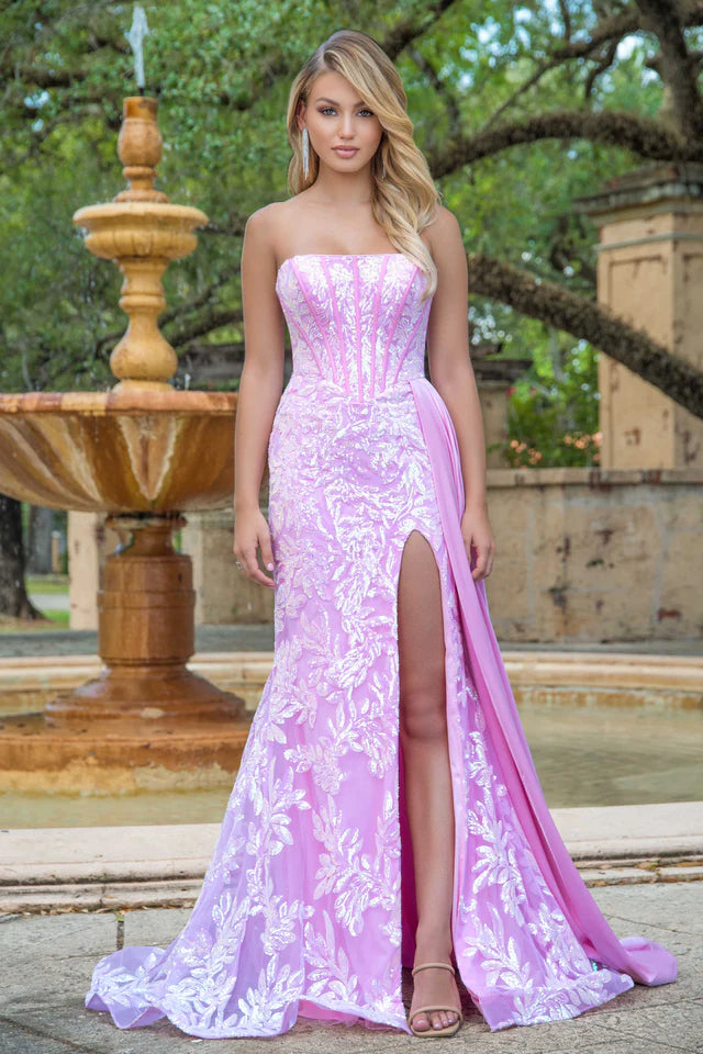 Elevate your formal attire with the Ava Presley 28291 Long Prom Dress. This strapless gown features a flattering corset design, charming side drape, and elegant train. Made with luxurious charmeuse fabric, it exudes sophistication and grace. Perfect for pageants, proms, or any special occasion.