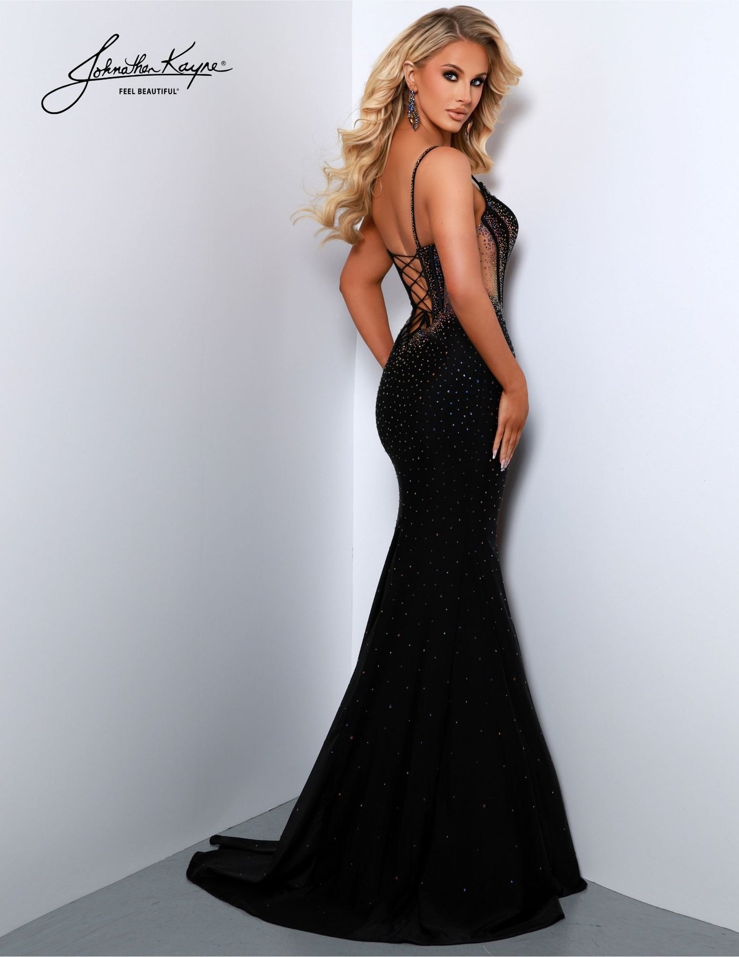 This elegant dress from Johnathan Kayne 2851 is sure to make you look and feel your best. Featuring a fitted Lycra bodice and beaded V-neck plunging neckline, the gown is both glamorous and timeless. It also features a long maxi slit with mesh detailing, perfect for any formal or pageant occasion. Make jaws DROP! This exquisite 4 Way Stretch Lycra gown features a thigh-high slit, a beaded bodice with exposed boning, and a design that's destined to captivate and command attention.