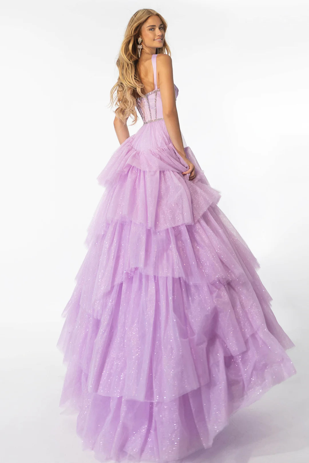 Step out in style with the Ava Presley 28592 Shimmer Tulle A Line Layer Ballgown Prom Dress. This stunning gown features a satin corset and crystal embellishments for a touch of elegance. The A-line silhouette and layered tulle skirt will make you feel like a princess. Perfect for prom or any special occasion.  Sizes: 00-16  Colors: Lilac, Black/White