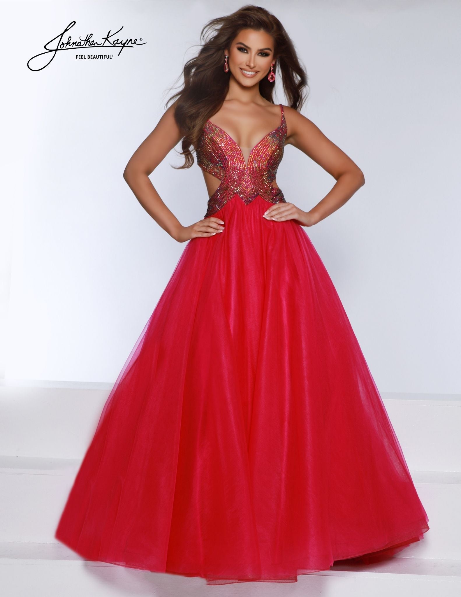 Make an unforgettable entrance with the Johnathan Kayne 2870 prom dress. A-Line tulle design features ombre stones, a plunging neckline, and elegant long cut. Make sure all eyes are on you at your formal event. A new take on classic ballgowns, the tulle gown features side cut outs and a daring back. Glisten like a star with the ombre stoning embellishments on the bodice that ensure you shine from every angle.