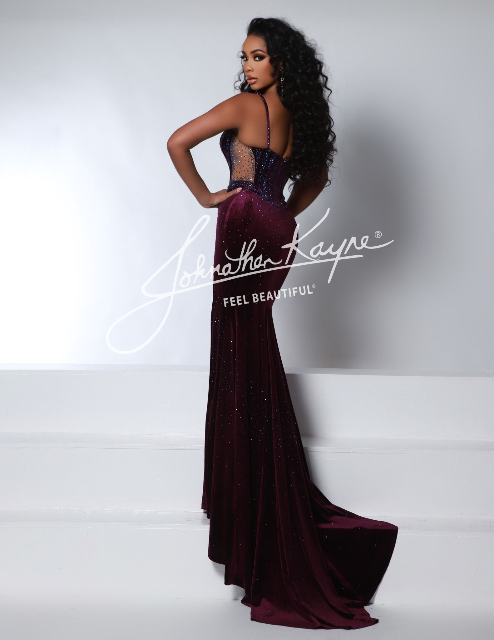 Be the center of attention in the Johnathan Kayne 2948 Long Velvet Sheer Formal Dress. This stunning dress features a luxurious velvet fabric, a sheer design, and a dramatic slit that will make you stand out at any formal event.