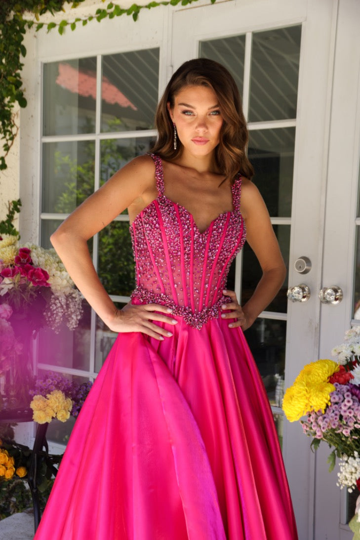 Get ready to stun in the Ava Presley 29521 Pageant Dress! With a long, sheer crystal corset and a flowing train, you'll feel like a true queen. Perfect for prom or any formal event, this ballgown will turn heads. Say yes to making a statement!