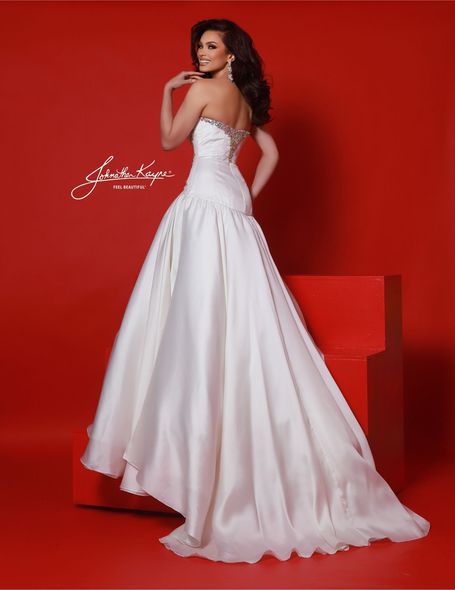 Expertly crafted by Johnathan Kayne, the 3045 Silk Ballgown is a stunning pageant dress with a drop waist and V-neckline. Made from luxurious silk, this dress is embellished with sparkling crystals for added glamour. Perfect for prom or any special occasion, it exudes elegance and sophistication. Babe, it's all in the details! Own the night in this divine Silk Gazar strapless ball gown. The drop waist brings sophistication, while the sumptuous fabric and fearless design make you the center of attention.

Si