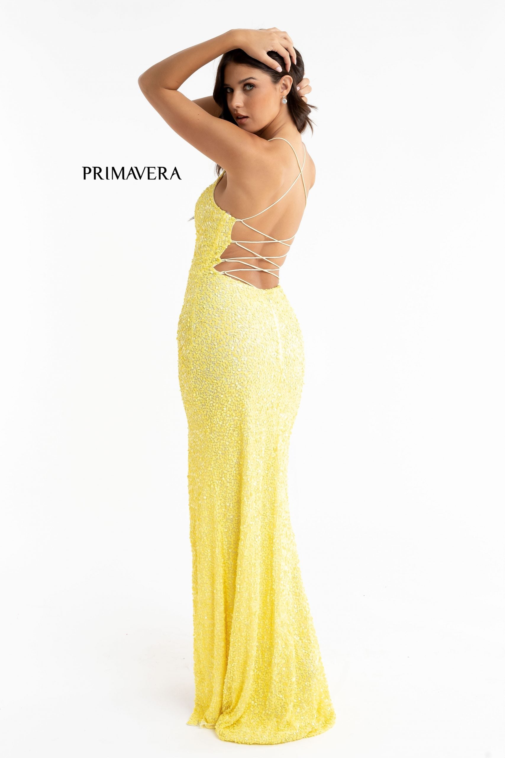 Primavera Couture 3290 This prom dress adds a pop to the multi sequins dress.  With a scoop neckline and spaghetti straps that cross and tie in the back.  This long evening dress has a side slit.  Available sizes:  000, 00, 0, 2, 4, 6, 8, 10, 12, 14, 16