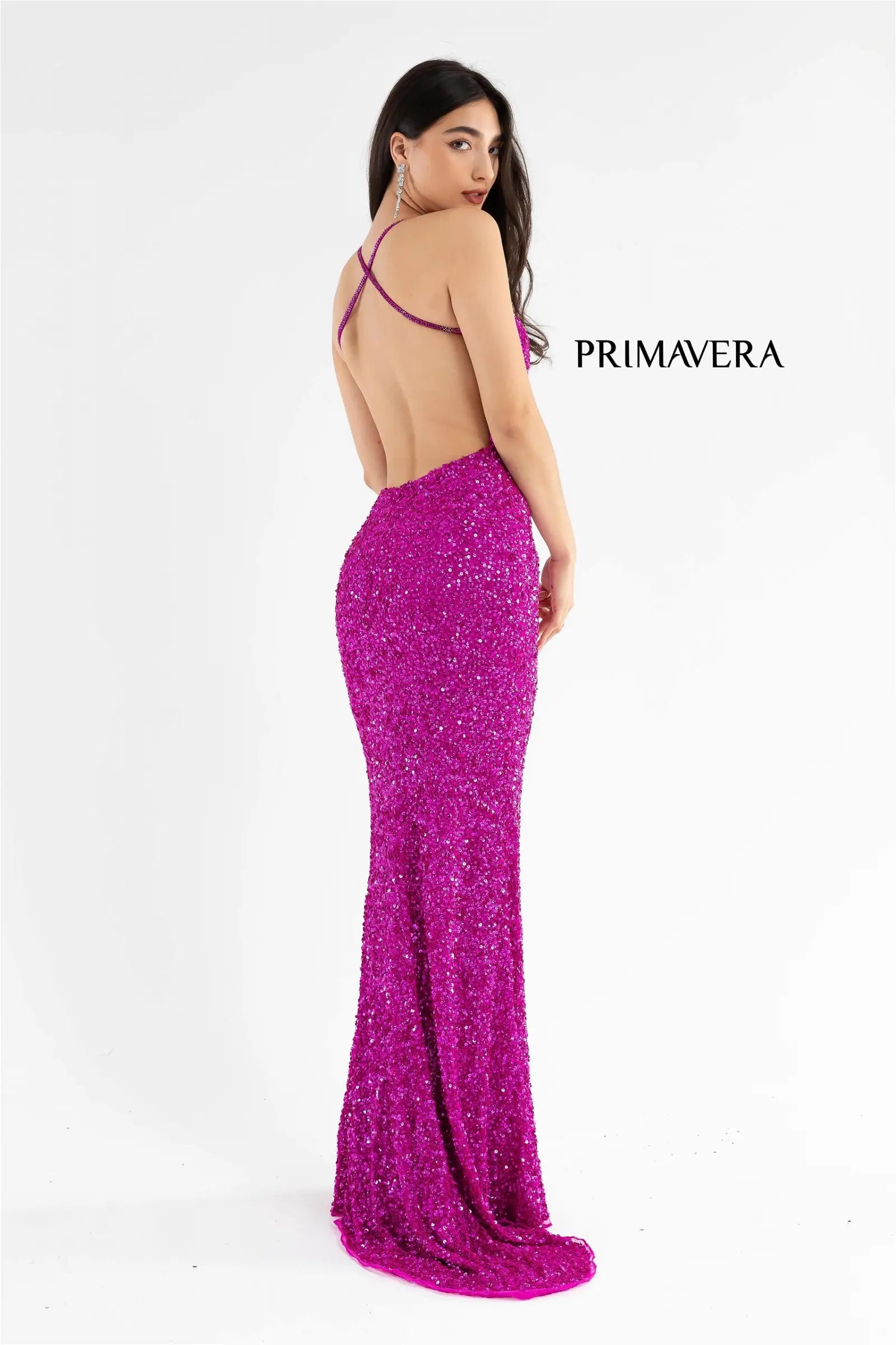 Primavera Couture 3291 Exclusive Prom Dresses.  This long prom dress is embellished throughout with shimmering sequins.  This impressive gown showcases a v neckline, thin beaded straps and crisscrossed straps in the open back. The long slim skirt has a sultry high side front slit. 