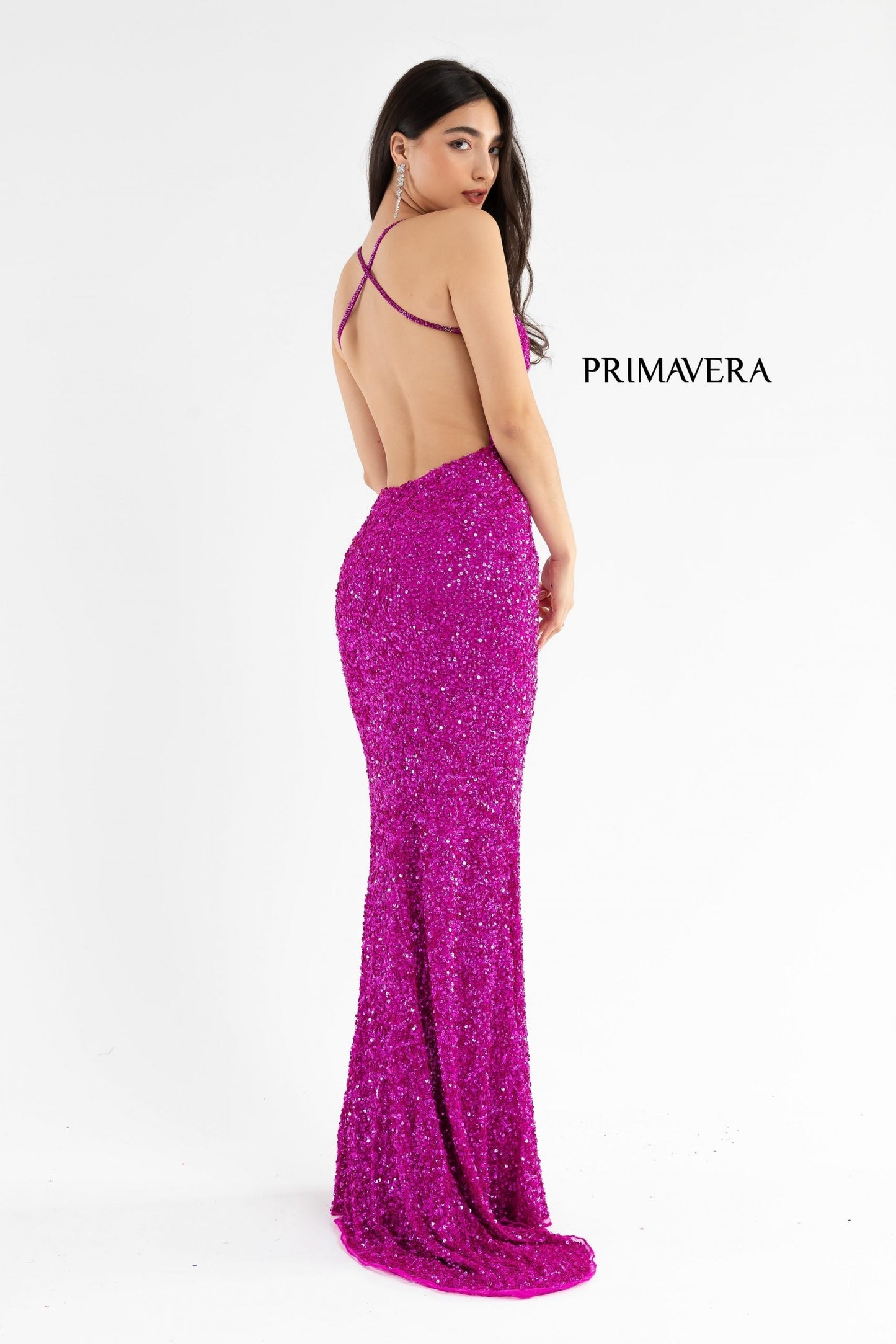 Primavera Couture 3291 Exclusive Prom Dresses.  This long prom dress is embellished throughout with shimmering sequins.  This impressive gown showcases a v neckline, thin beaded straps and crisscrossed straps in the open back. The long slim skirt has a sultry high side front slit. 