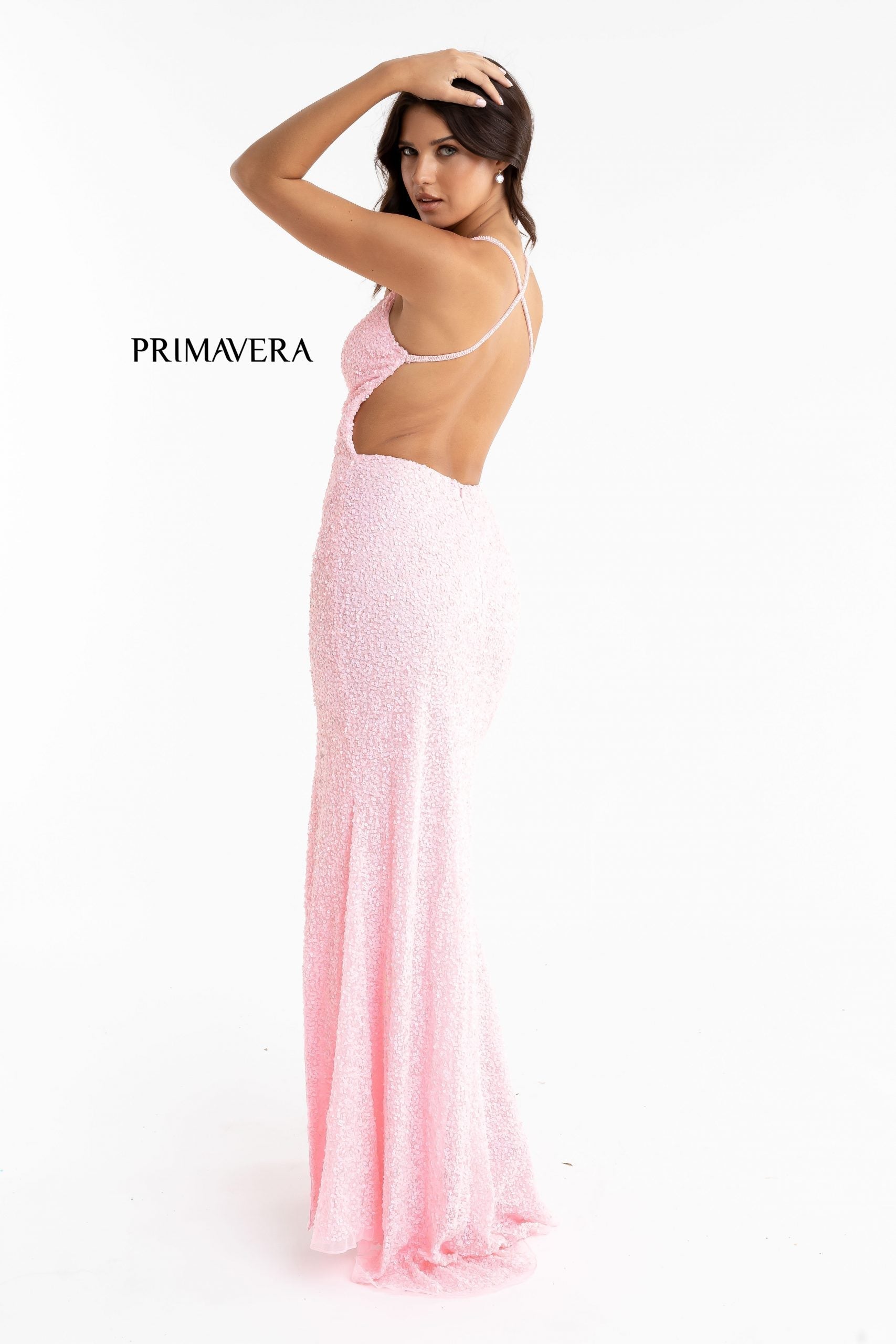 Primavera Couture 3291 Exclusive Prom Dresses.  This long prom dress is embellished throughout with shimmering sequins.  This impressive gown showcases a v neckline, thin beaded straps and crisscrossed straps in the open back. The long slim skirt has a sultry high side front slit. 